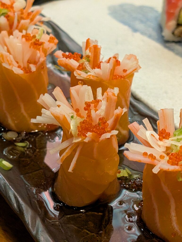 Cherry Blossom roll at Tekka Sushi, salmon shaped into flowers with crab and orange tobiko centers