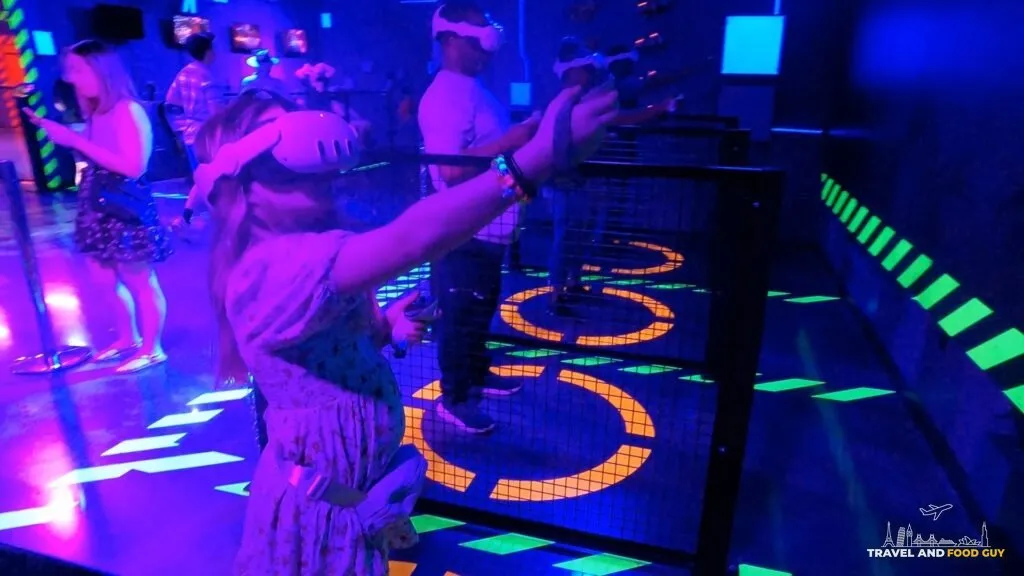 Emily in a VR headset at an Area 15 mixed reality attraction