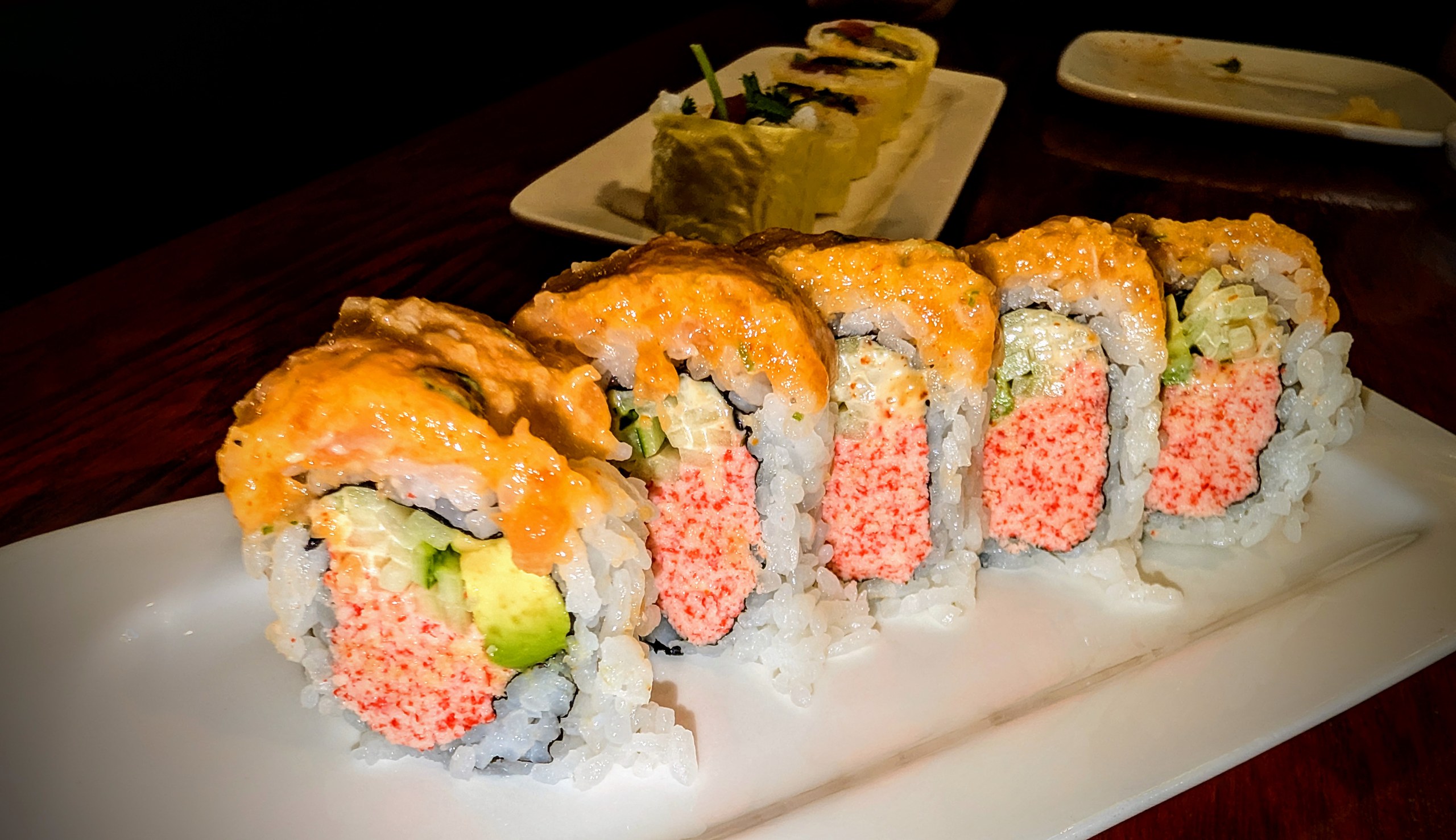 Half Alaskan roll at Ari Sushi, salmon and crab inside with spicy mayo on top