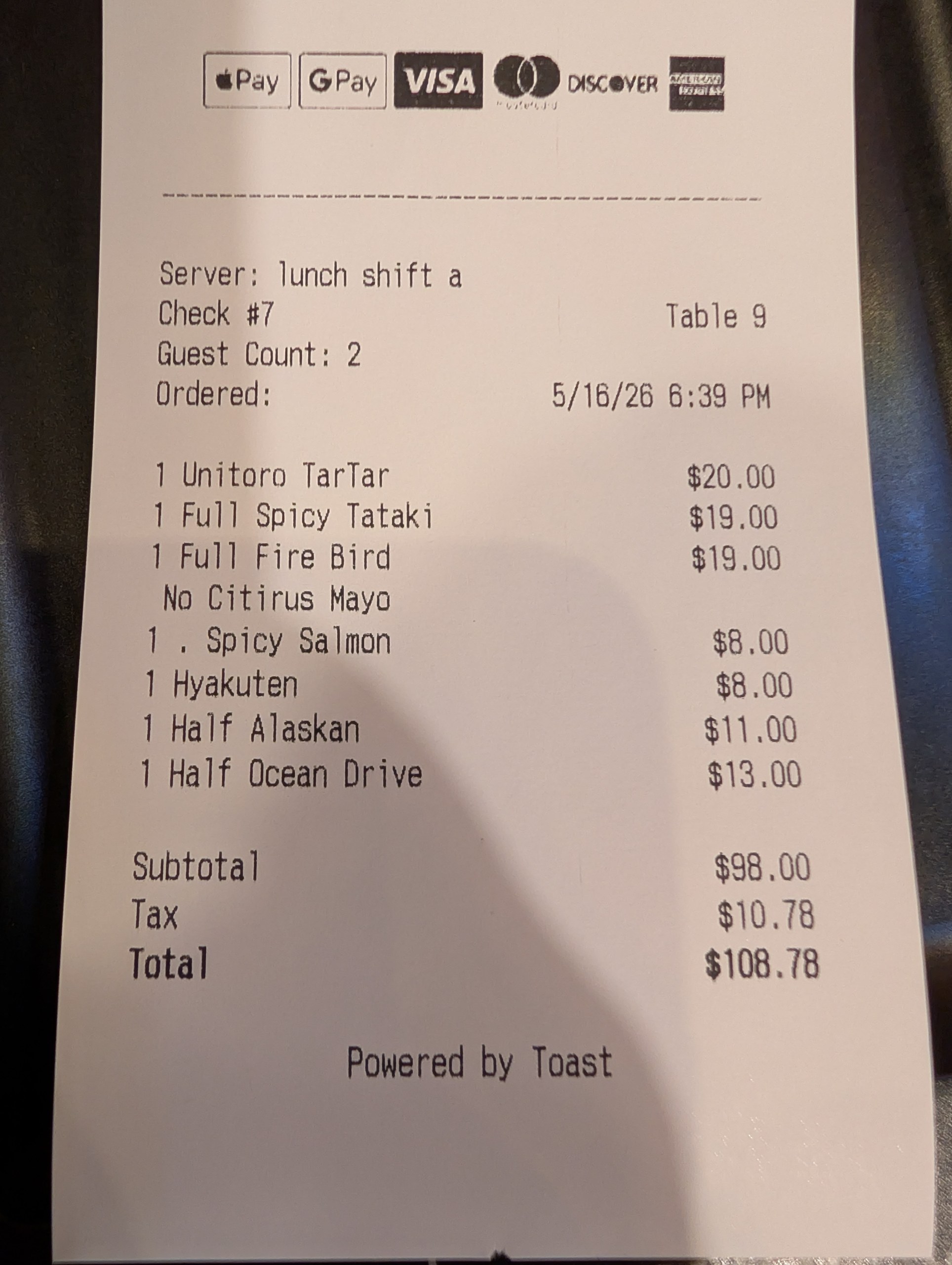Ari Sushi Des Plaines receipt showing Unitoro Tartar, Spicy Tataki, Fire Bird, Spicy Salmon, Half Alaskan, Half Ocean Drive, and a Hyakuten beer