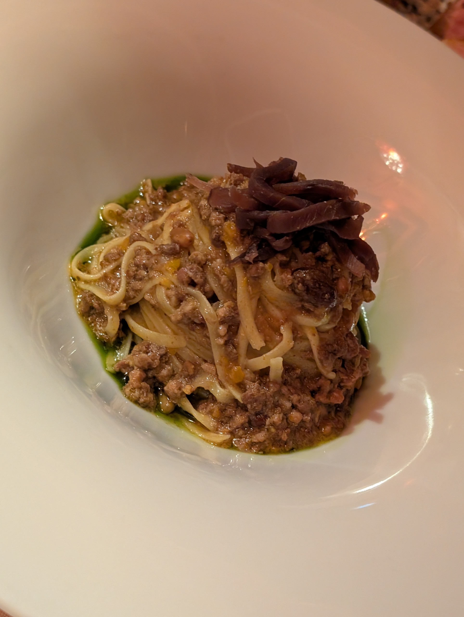 Tagliatelle al ragù topped with thinly shaved cured meat at Bistrot de Venise, Venice