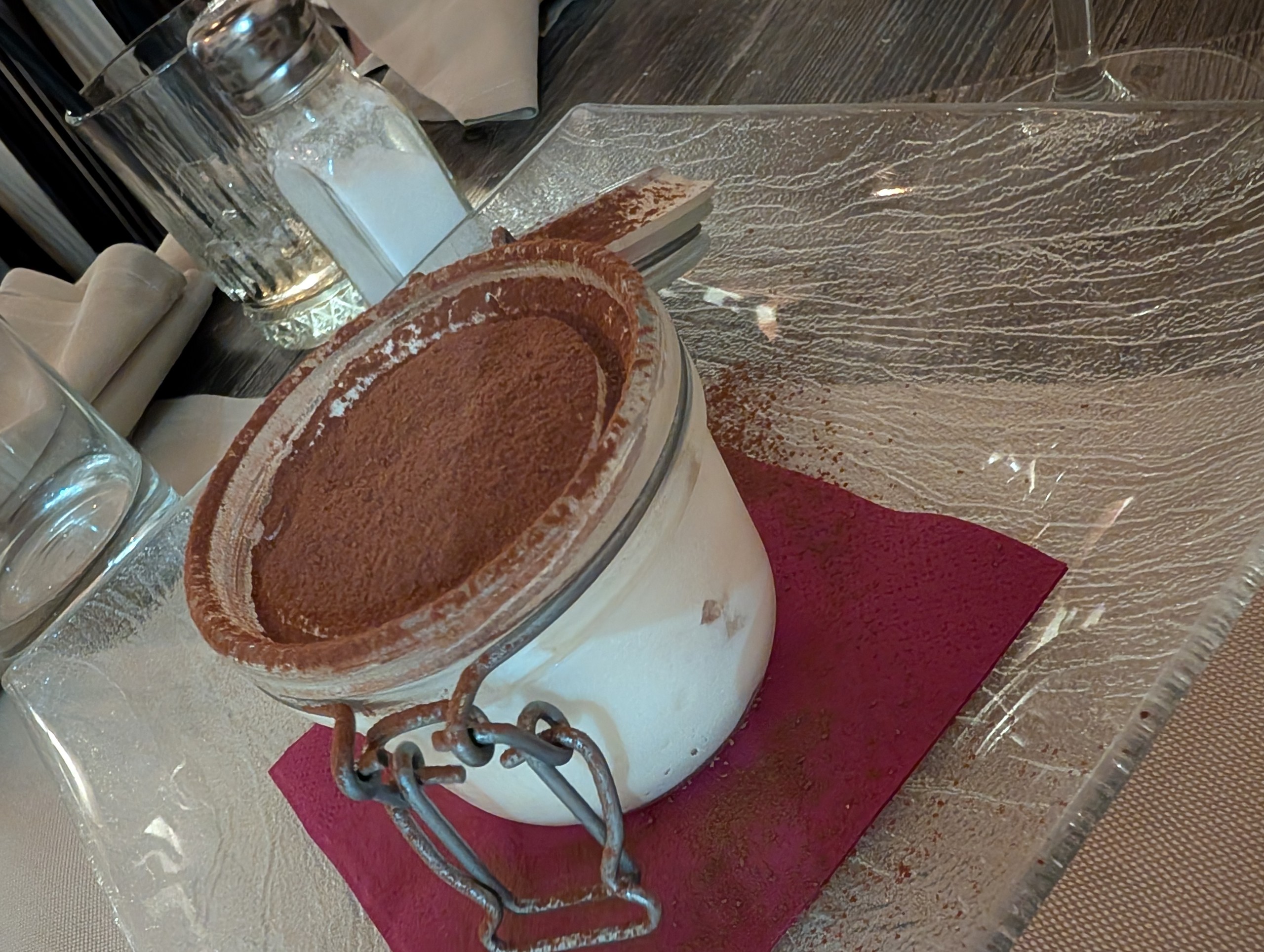 Tiramisu in a clamp-top glass jar with cocoa dusting at Cantinetta delle Terme, Florence