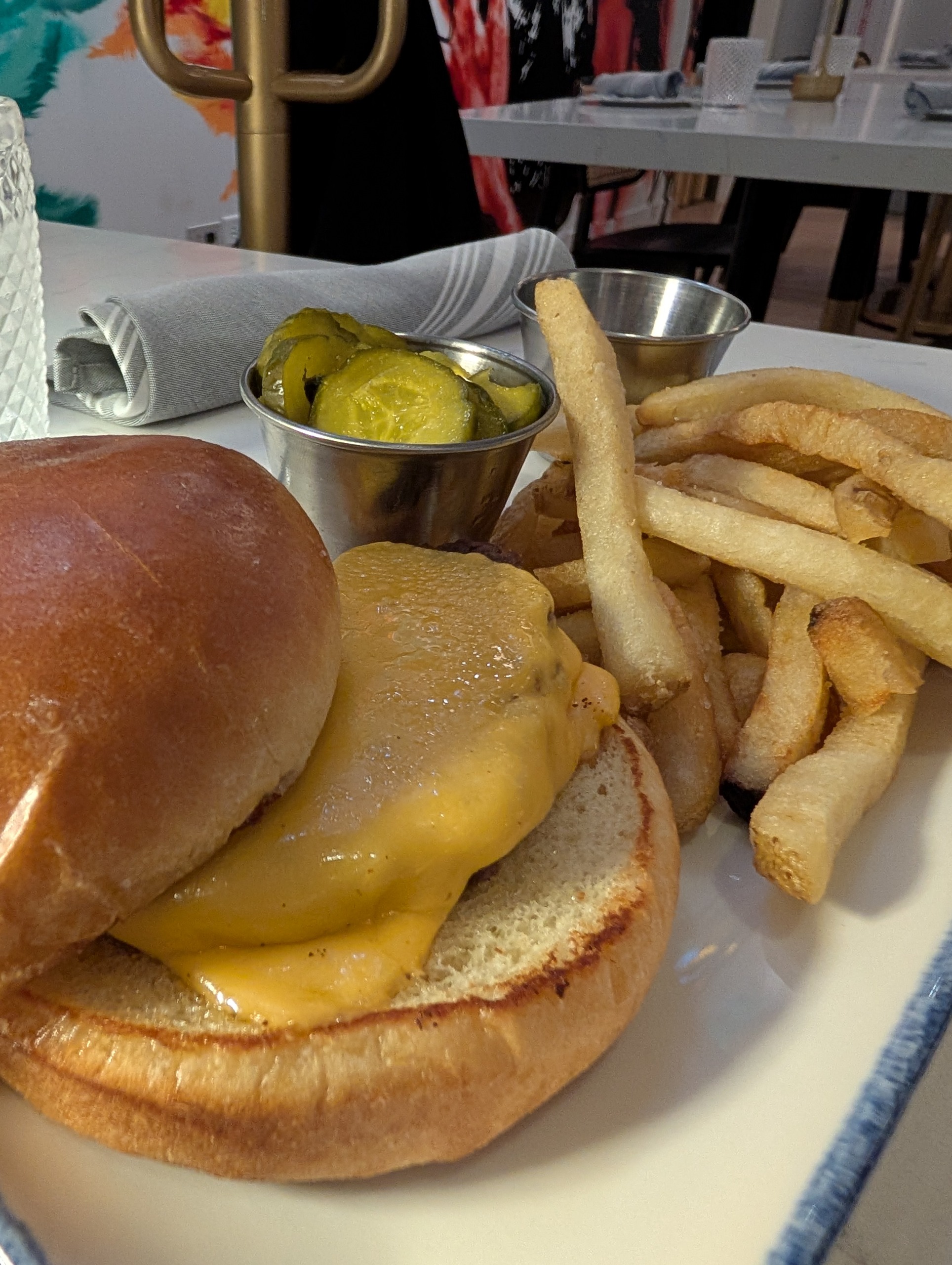 Kids cheeseburger with fries and pickles at The Foxtail on the Lake
