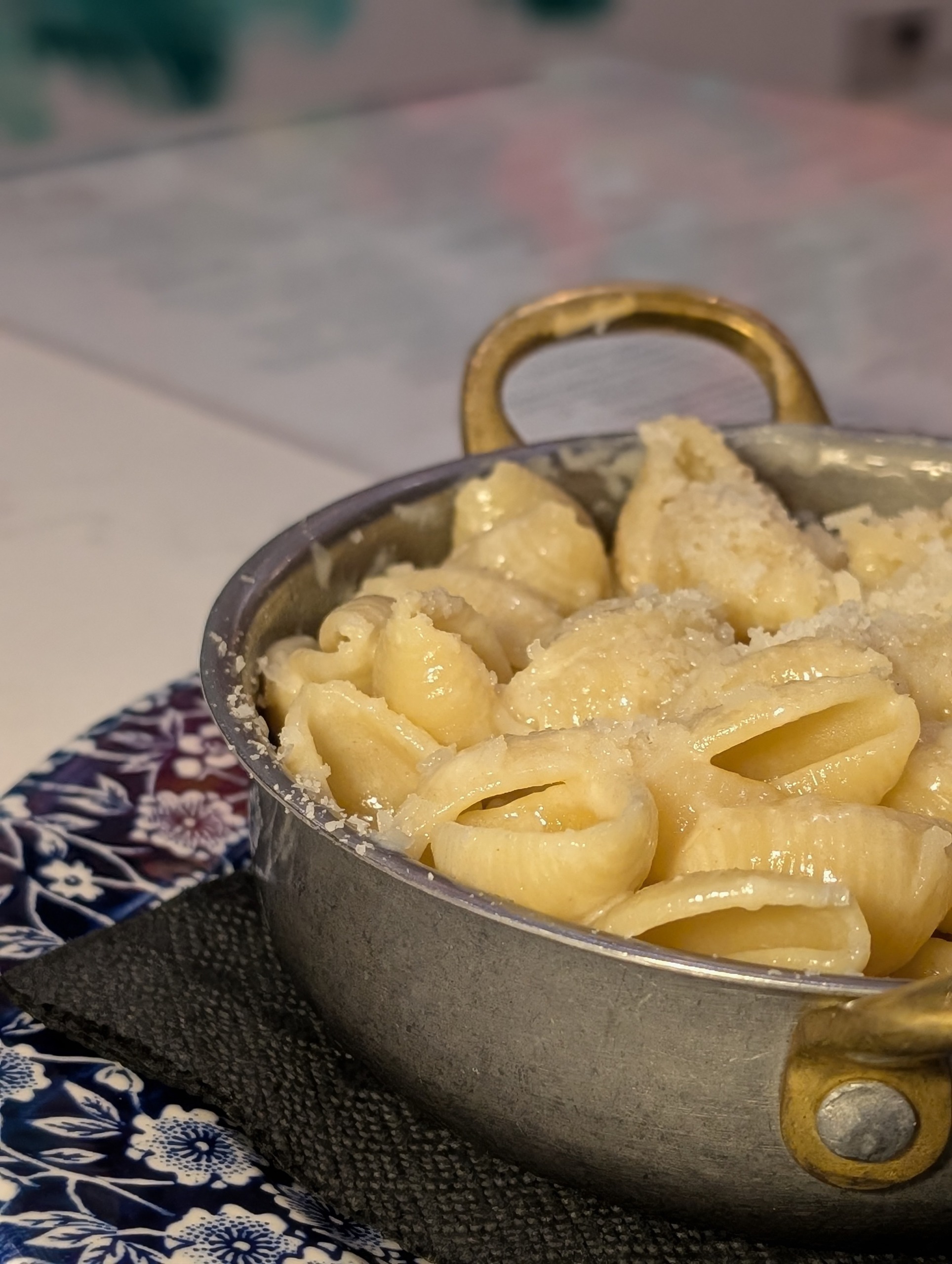 Kids mac and cheese in a brass handle pan at The Foxtail on the Lake