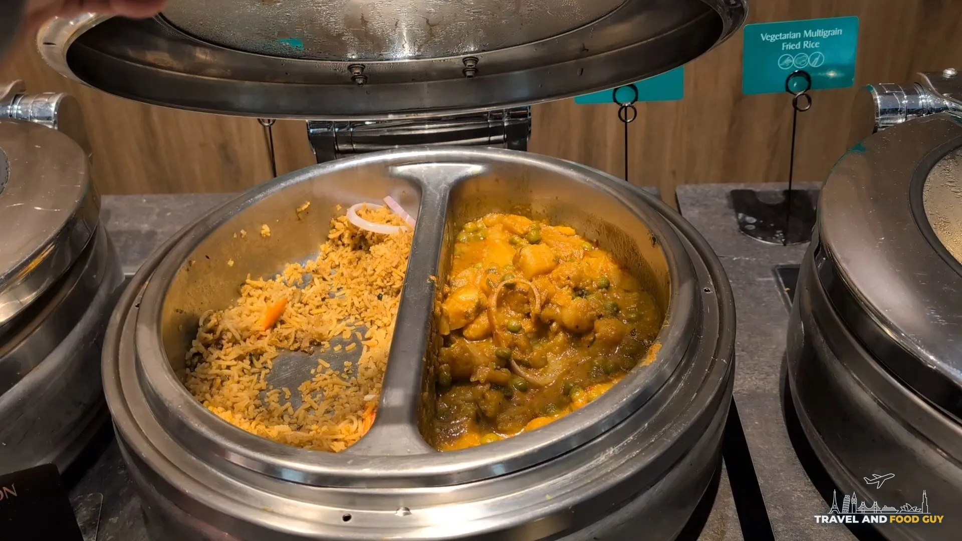 Aloo mattar curry and vegetarian multigrain fried rice in a split steam tureen at the Indian station.
