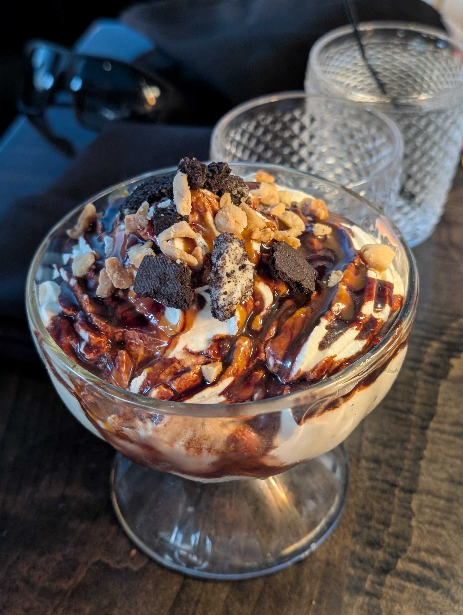 Ice Cream Sundae with chocolate sauce, candied nuts, and crumbled chocolate cookies at LAGO Lake Zurich