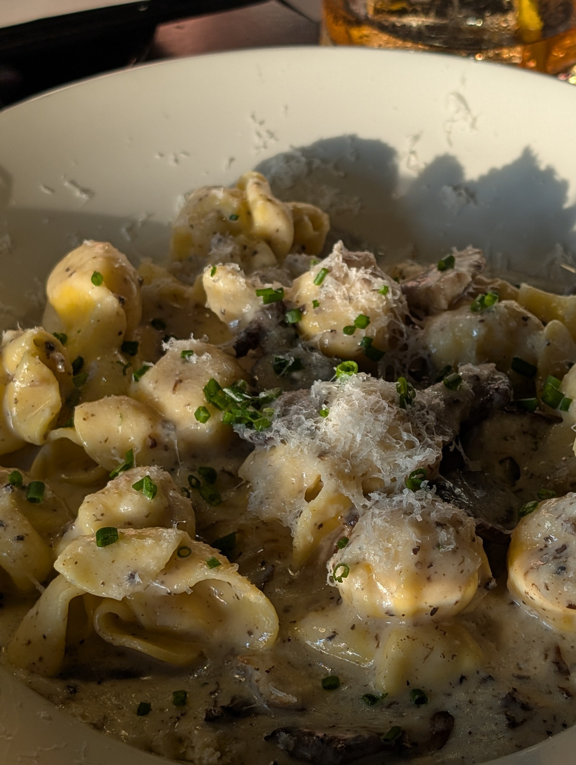 Truffled Purses pasta in truffle parmesan cream sauce with grated cheese and chives at LAGO Lake Zurich