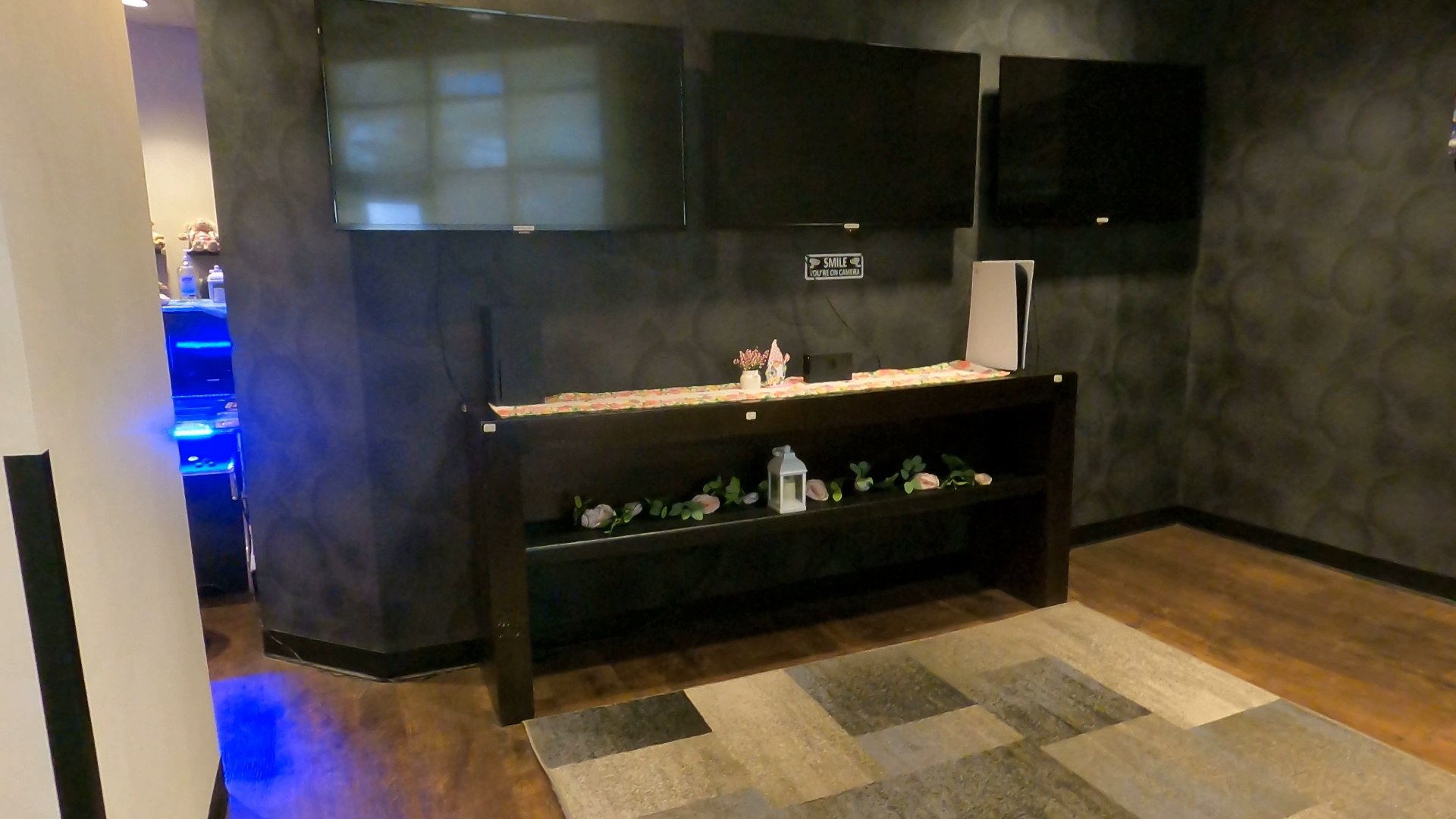 Three gaming TVs and a PlayStation console in the activities room at the Marriott Grand Chateau Las Vegas
