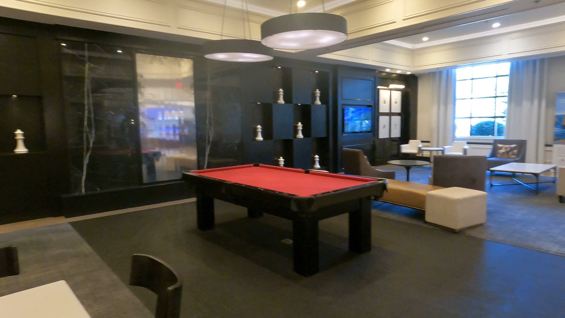 Pool table game room off the Marriott Grand Chateau lobby with chess piece decor