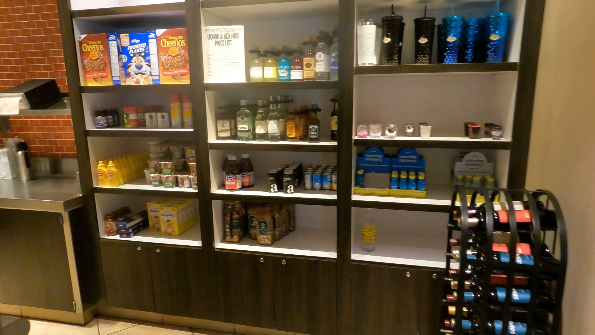 Cereal, juice, and packaged snack shelves at the Marketplace pantry inside the Marriott Grand Chateau Las Vegas