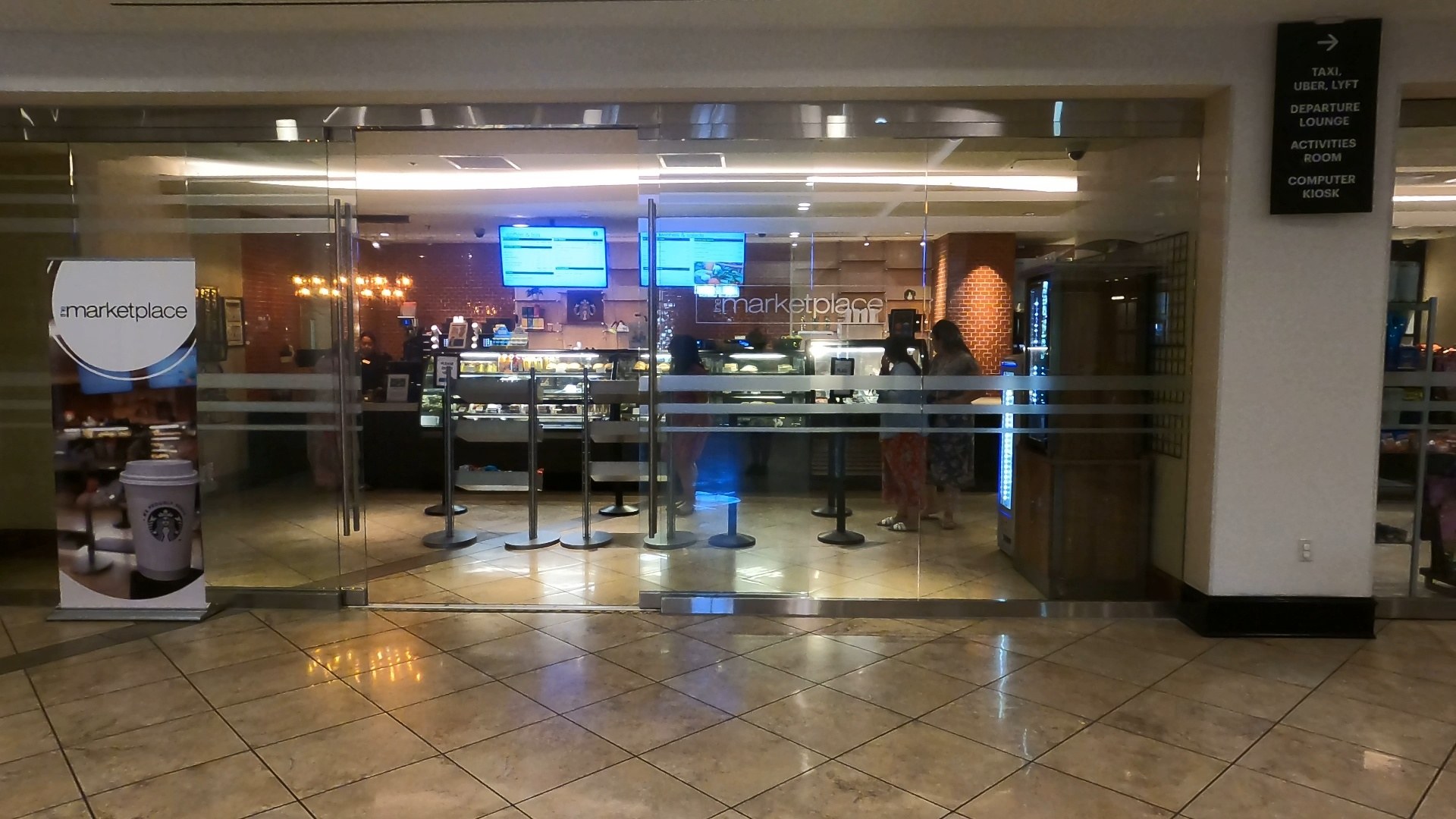 Glass entrance to the Marketplace pantry and Starbucks at the Marriott Grand Chateau Las Vegas