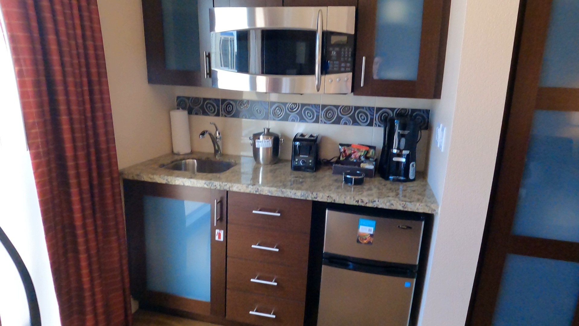 Kitchenette with microwave, sink, mini fridge and toaster in the second bedroom of the Marriott Grand Chateau two-bedroom suite