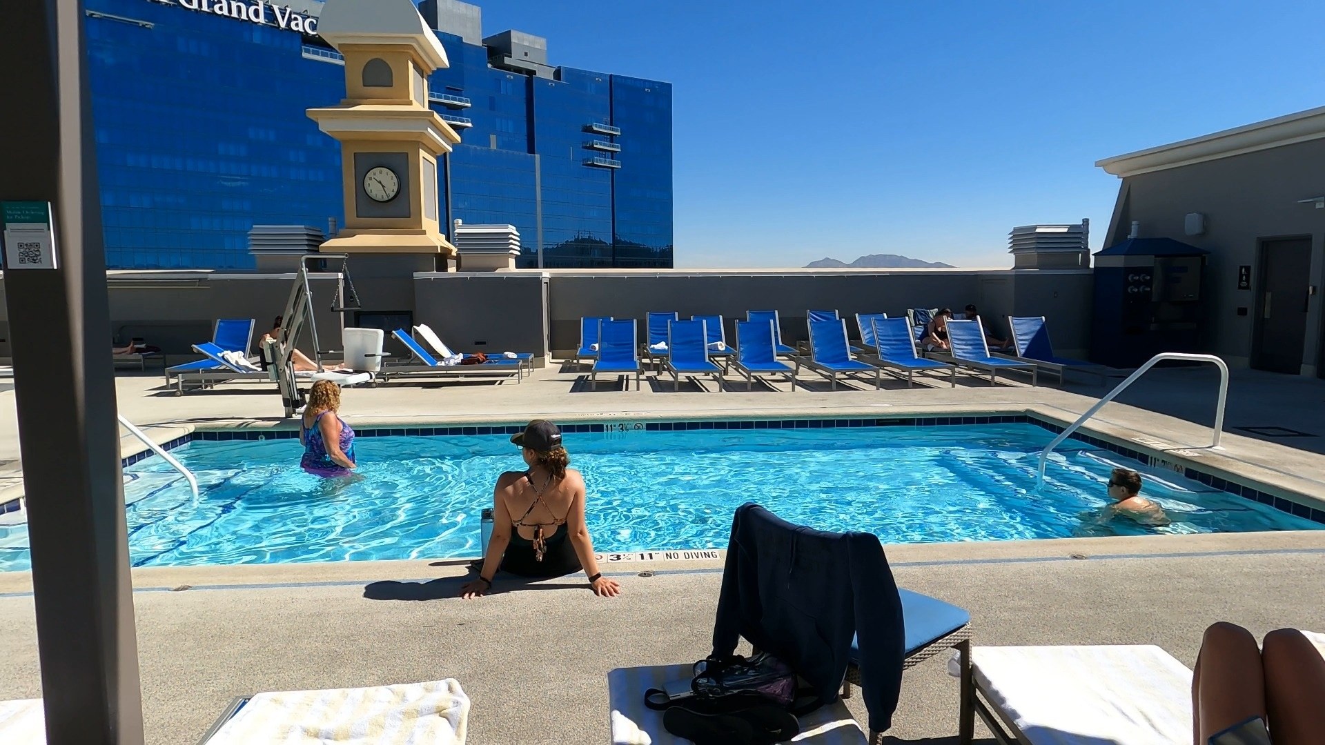 Upper pool at the Marriott Grand Chateau Las Vegas with a clock tower and desert mountain views