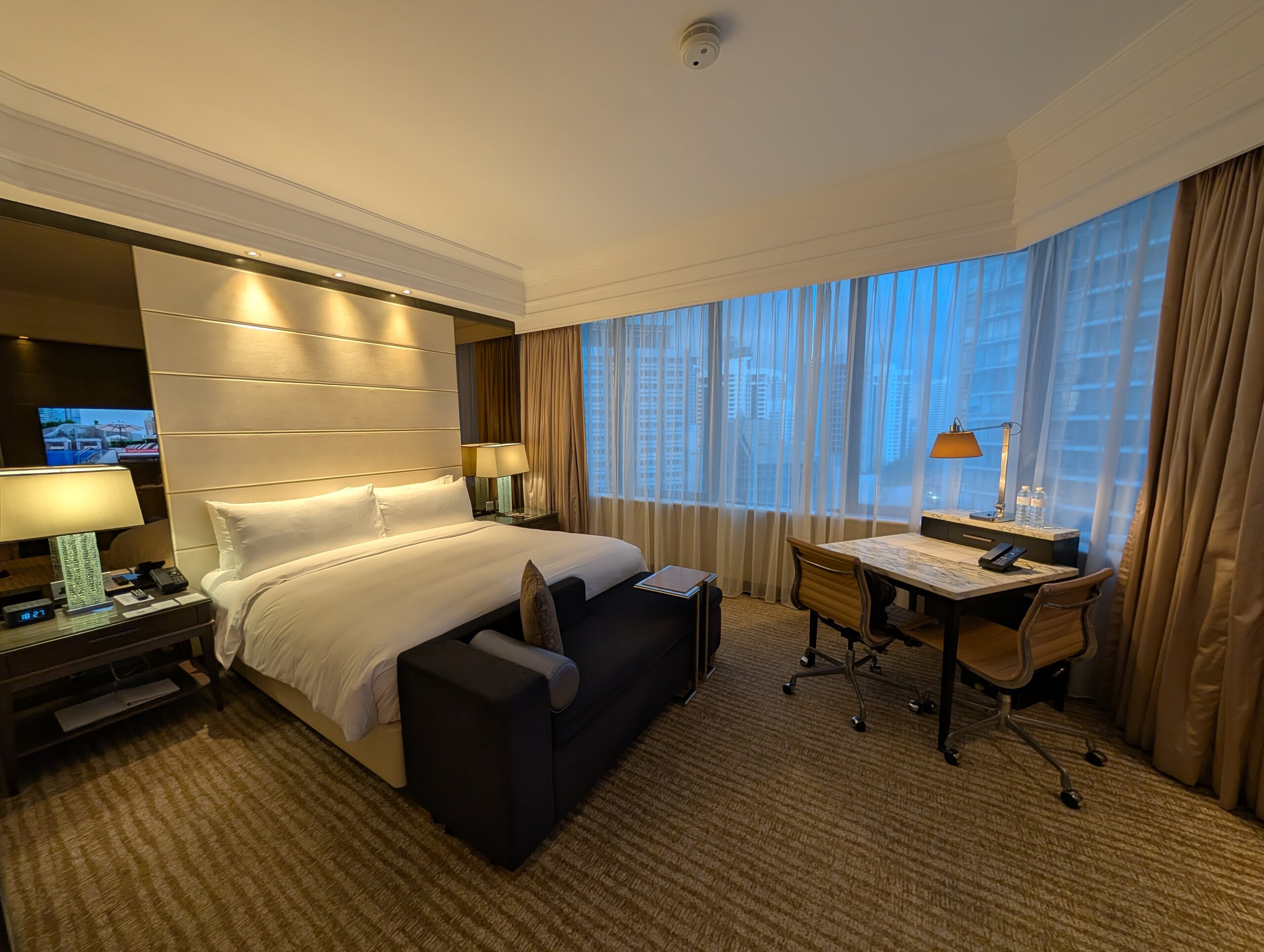 King bed, work desk, and window in the Singapore Marriott Tang Plaza Executive King room