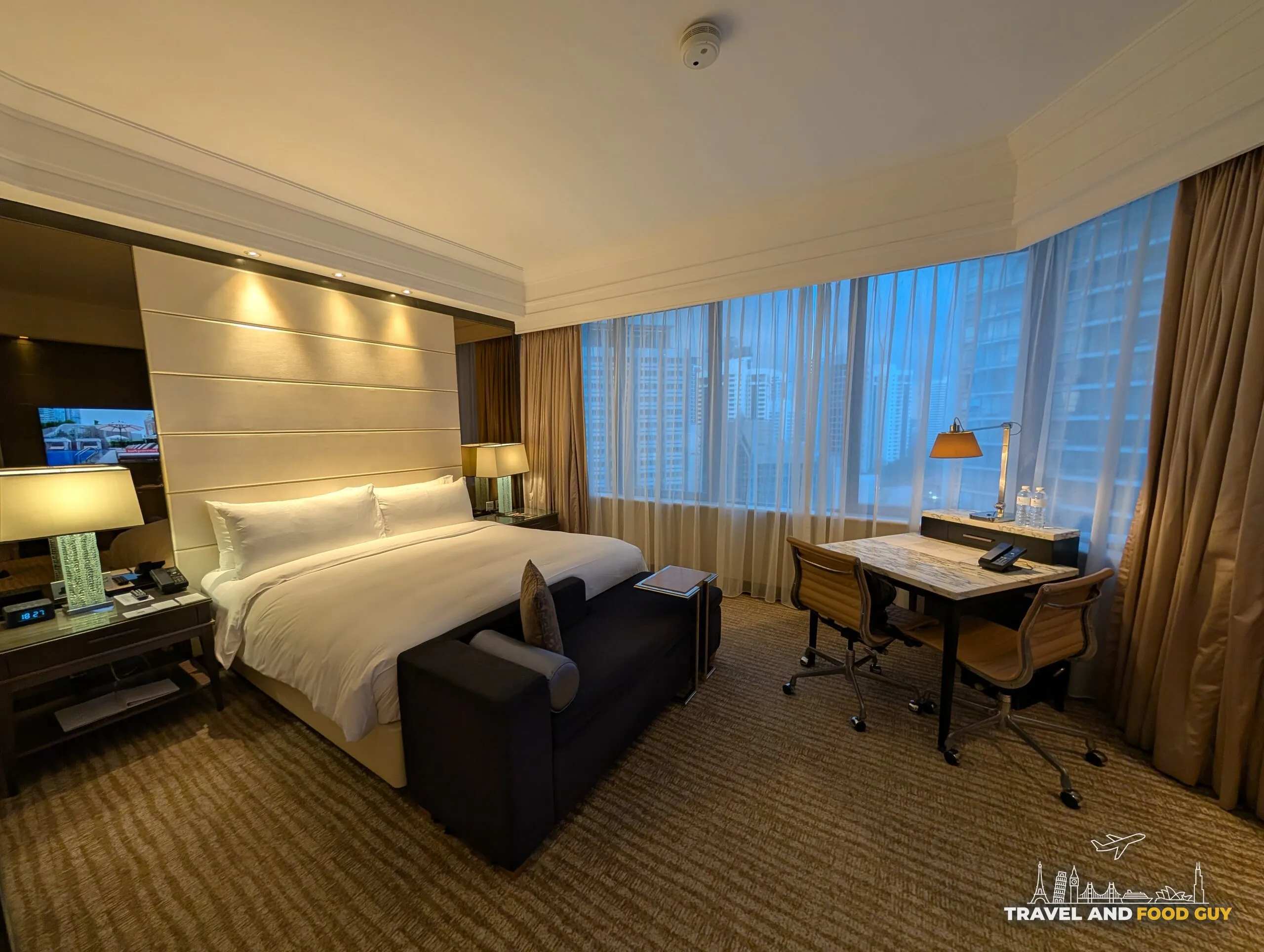 King bed, work desk, and window in the Singapore Marriott Tang Plaza Executive King room