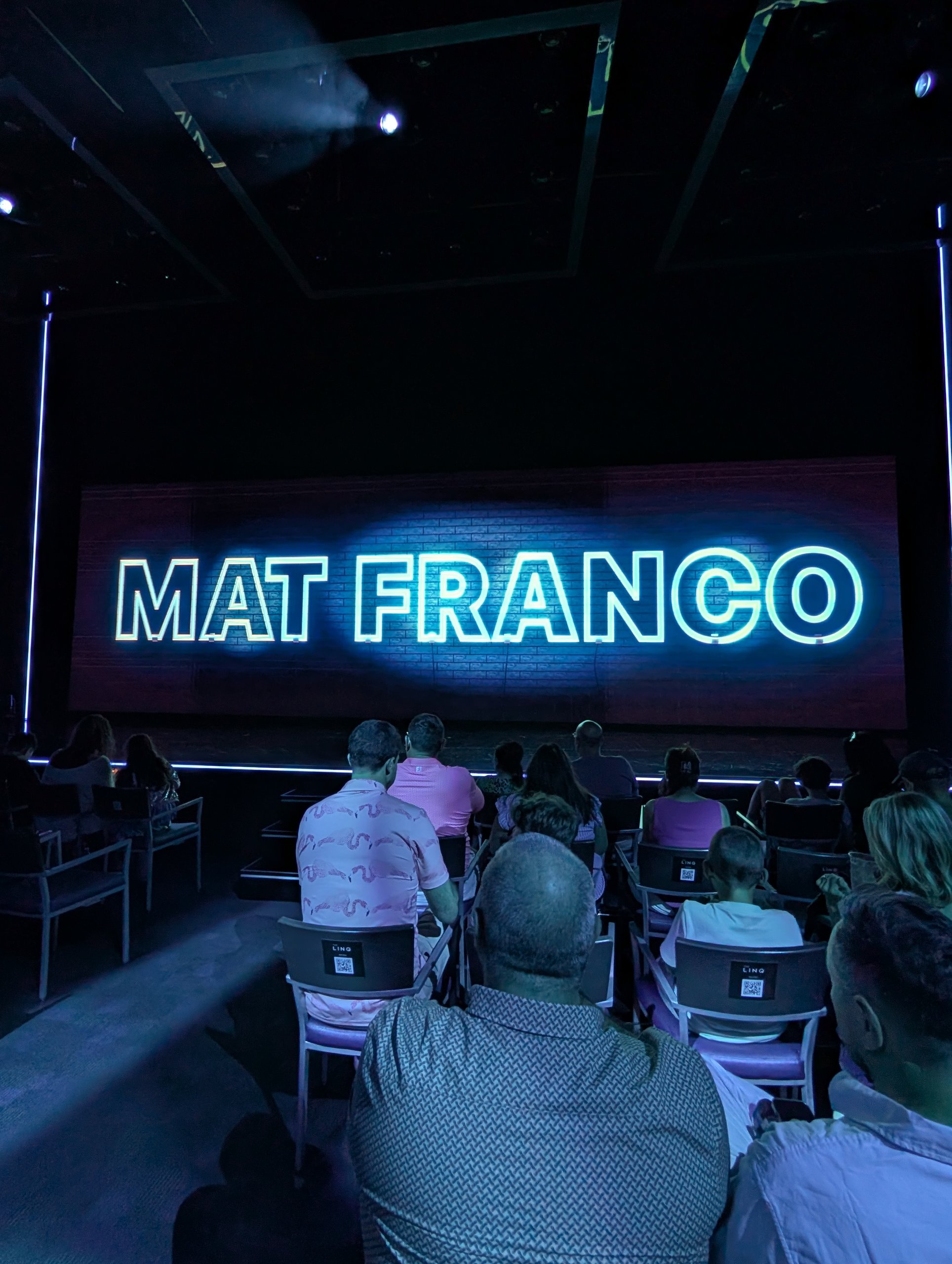 Mat Franco neon sign on the stage backdrop at The Linq before the show begins