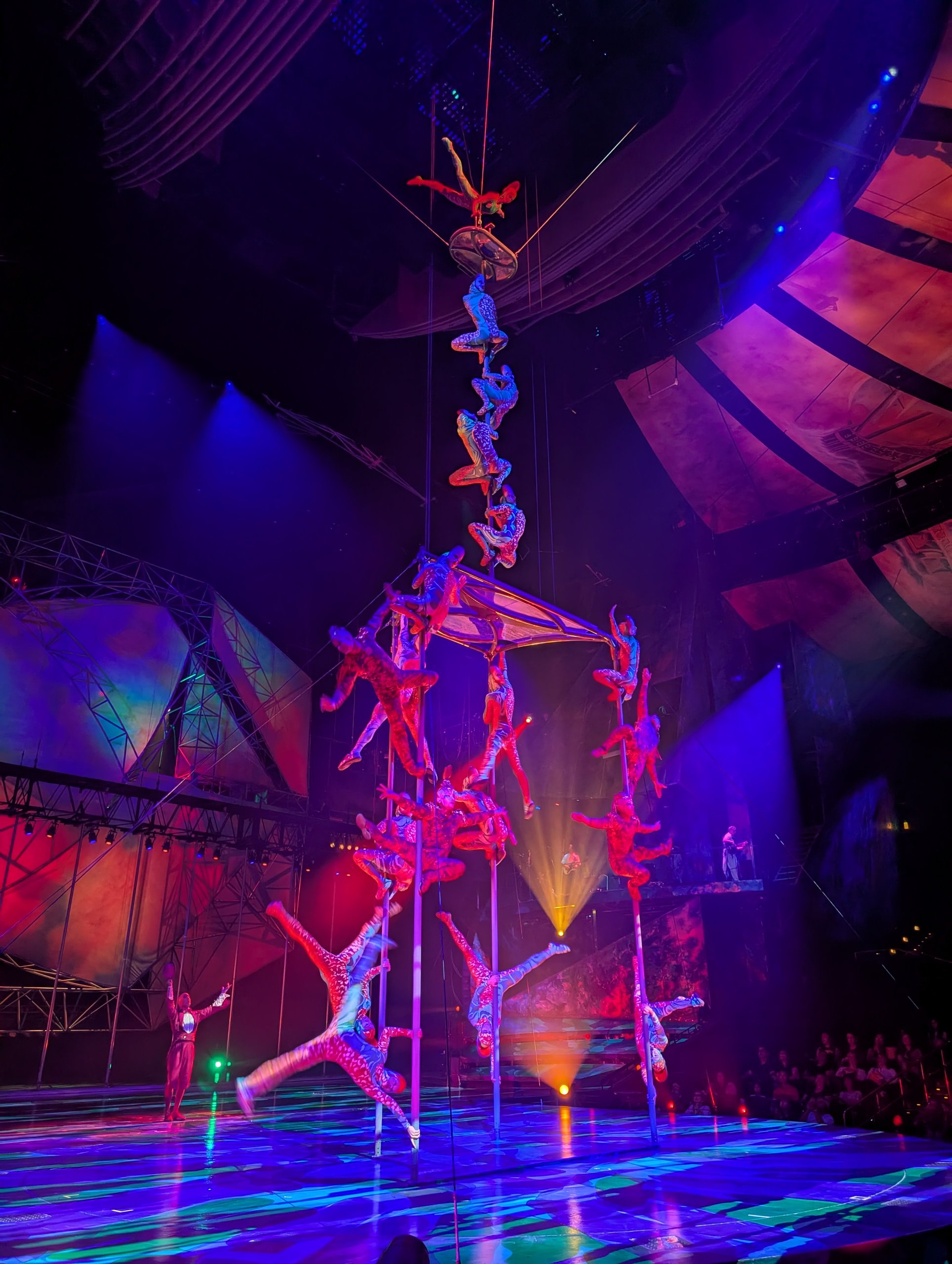 Mystère acrobats stacked vertically on a Chinese pole during the Treasure Island show