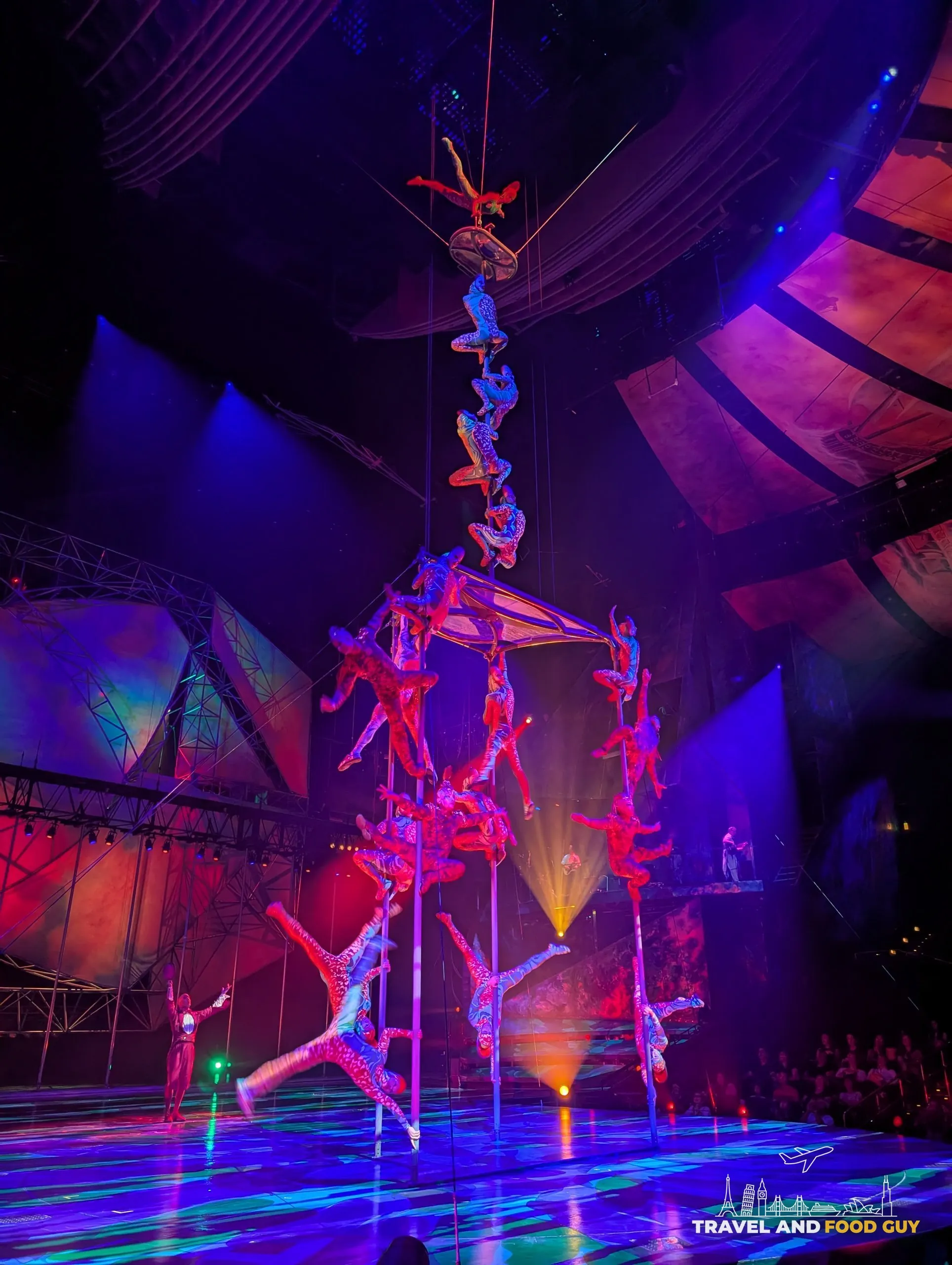 Mystère acrobats stacked vertically on a Chinese pole during the Treasure Island show