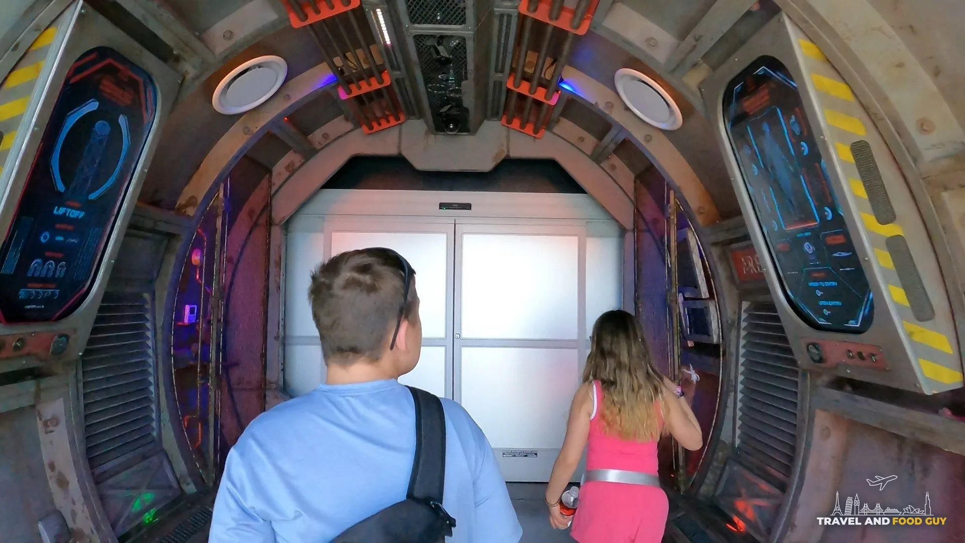Walking through the futuristic corridor entrance to Omega Mart by Meow Wolf at Area 15