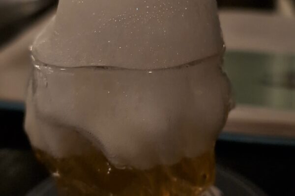 Close-up of the Saz-Air-Ak at Origin Grill and Bar with absinthe air foam piled on top of the glass.
