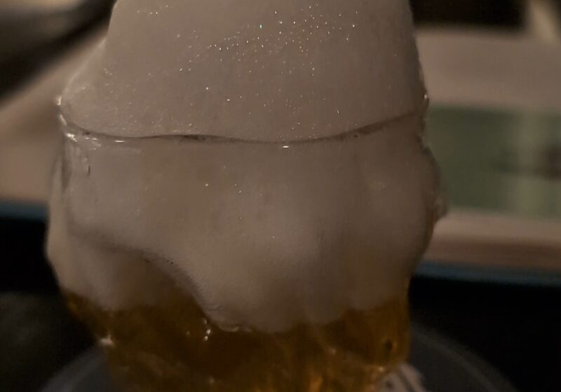 Close-up of the Saz-Air-Ak at Origin Grill and Bar with absinthe air foam piled on top of the glass.