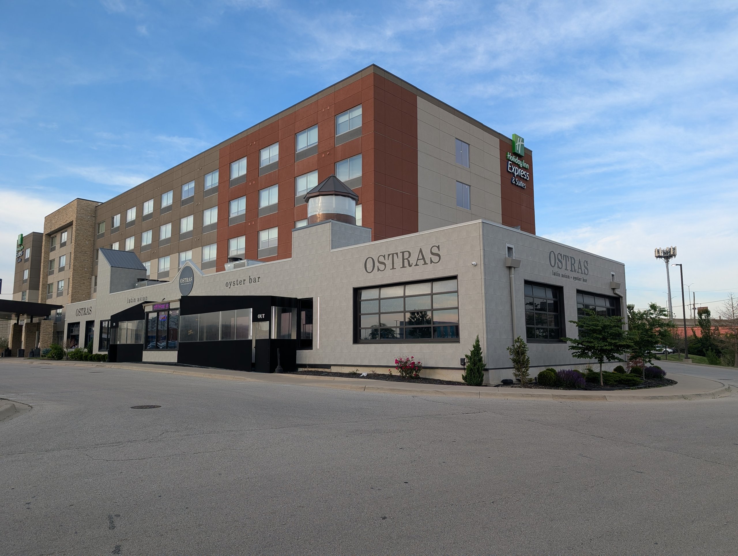 Exterior of Ostras Lounge oyster bar attached to a Holiday Inn Express and Suites in Des Plaines, Illinois