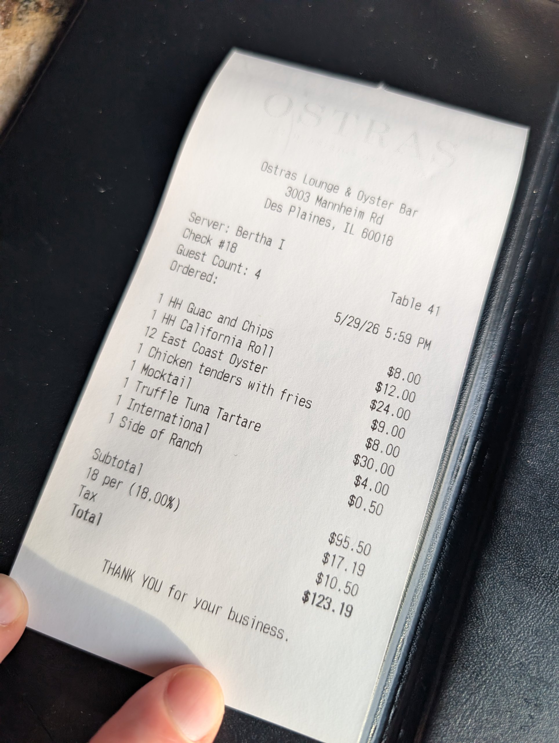 Itemized receipt from Ostras Lounge totaling $123.19 for a party of four