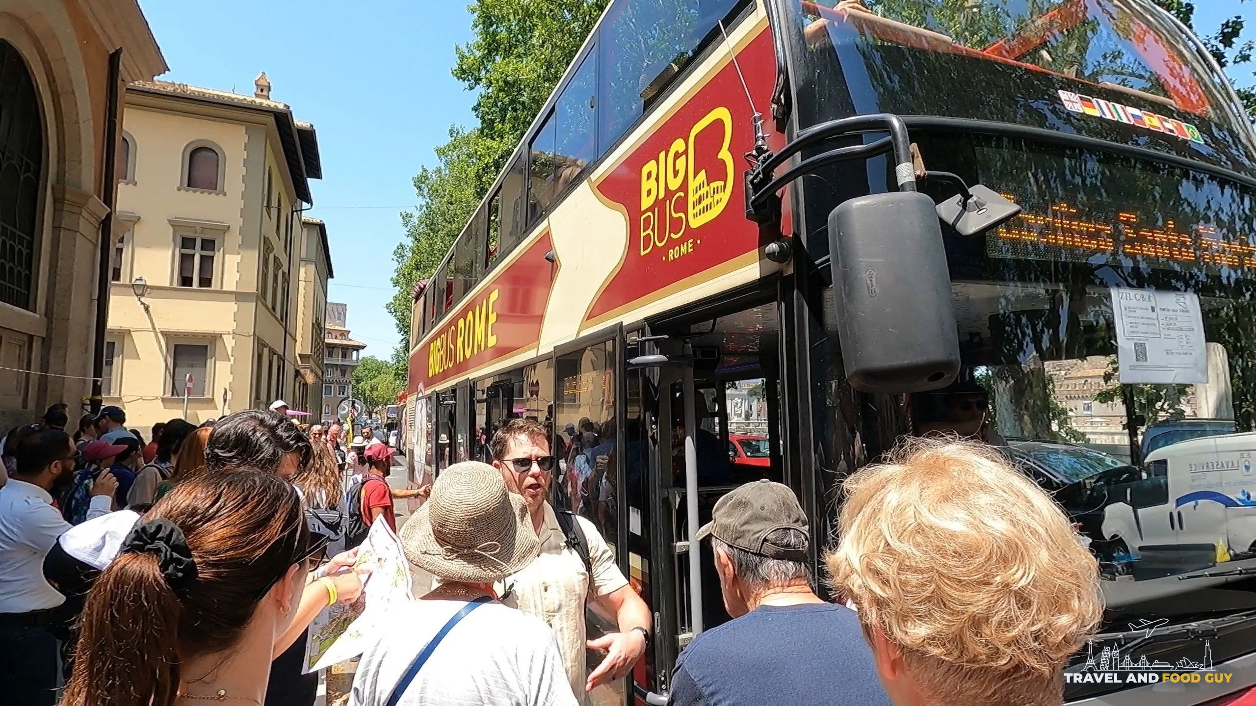 Big Bus Rome Hop-On / Hop-Off double-decker at a curbside stop with passengers on the sidewalk