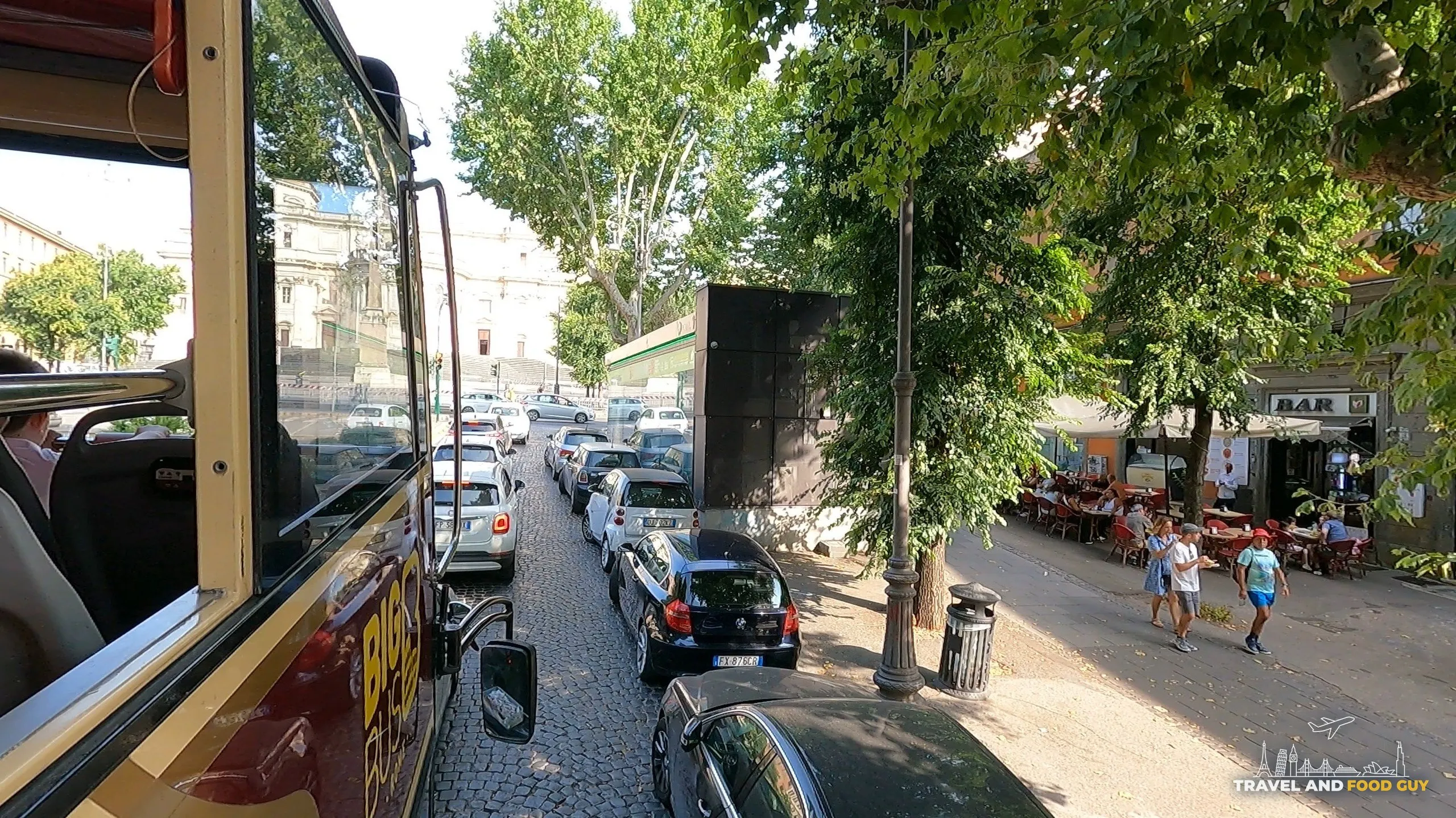 View from the upper deck of the Rome Hop-On / Hop-Off bus over a cobblestone street