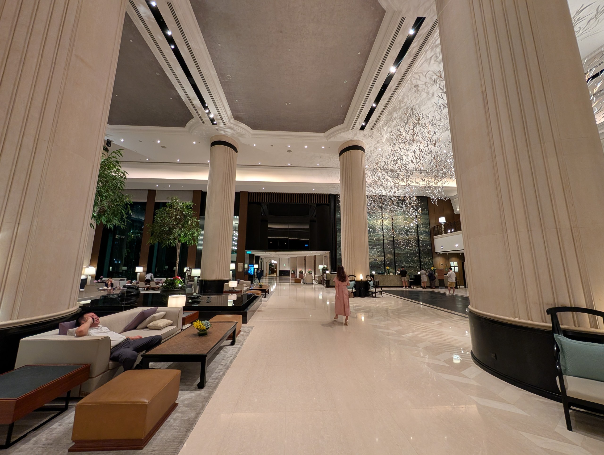 The Shangri-La Singapore main lobby with cream marble columns and silver-leaf installation.