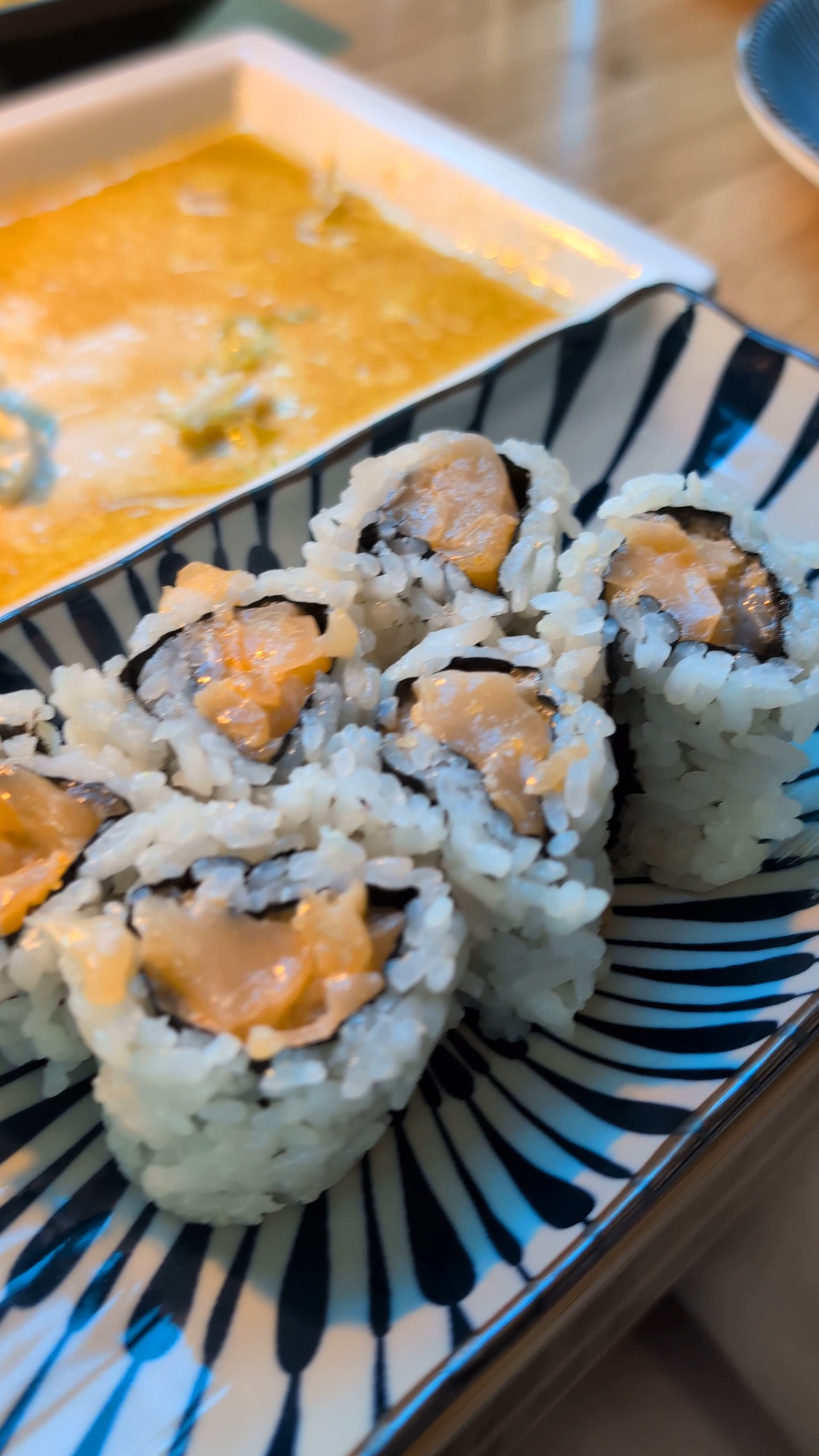 Spicy tuna cut roll at Sushi Roku Las Vegas served on a blue striped plate