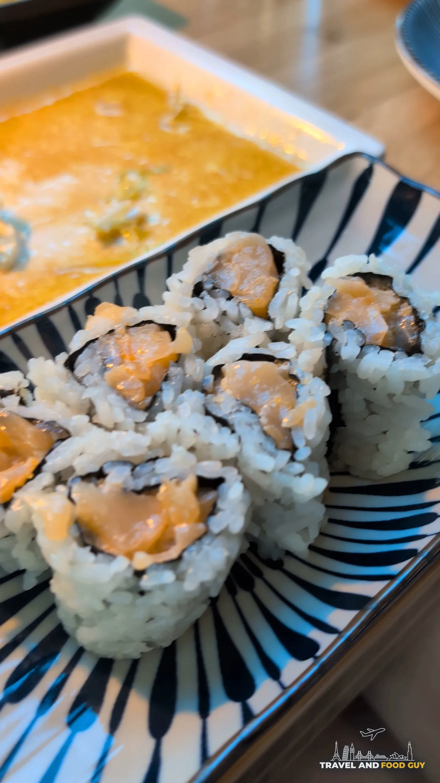 Spicy tuna cut roll at Sushi Roku Las Vegas served on a blue striped plate