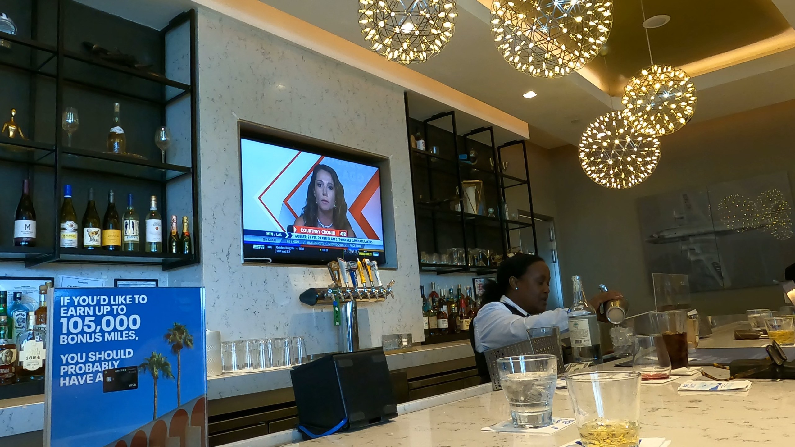 Marble bar and bartender at the United Club at DFW