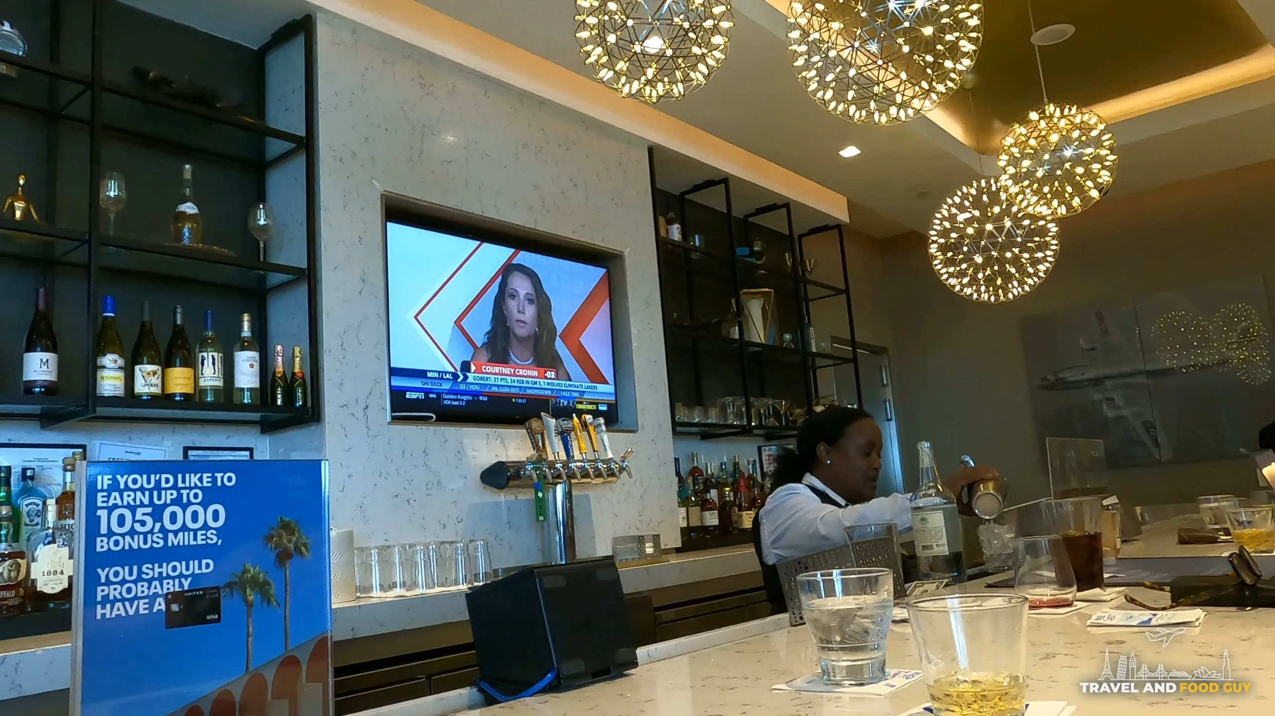 Marble bar and bartender at the United Club at DFW