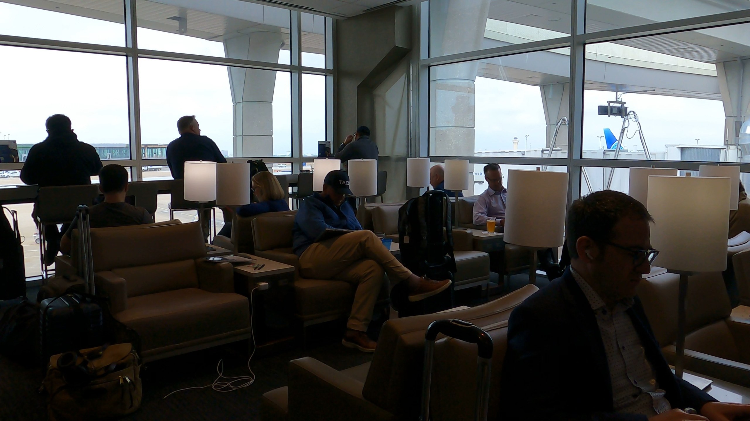Window lounge chairs facing the tarmac at the United Club at DFW