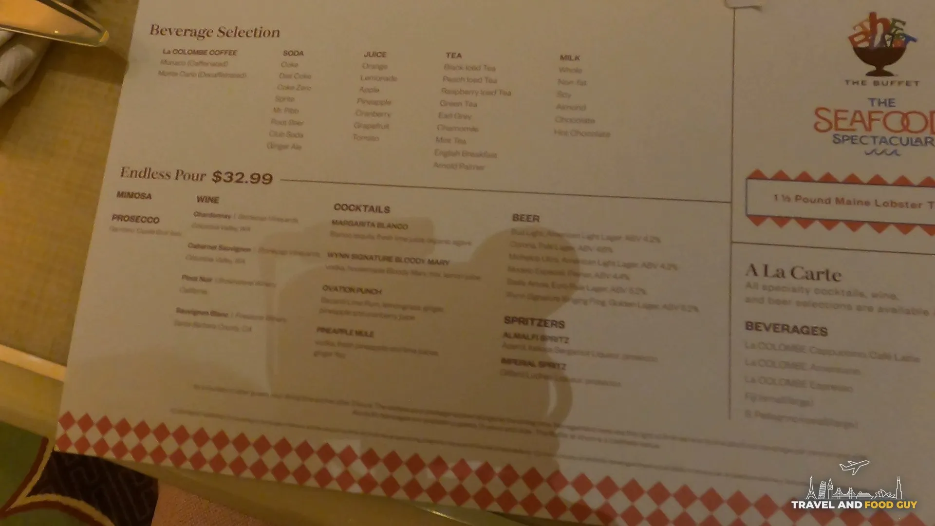Beverage menu at The Buffet at Wynn showing the $33 endless pour package and $90 Maine lobster tail supplement