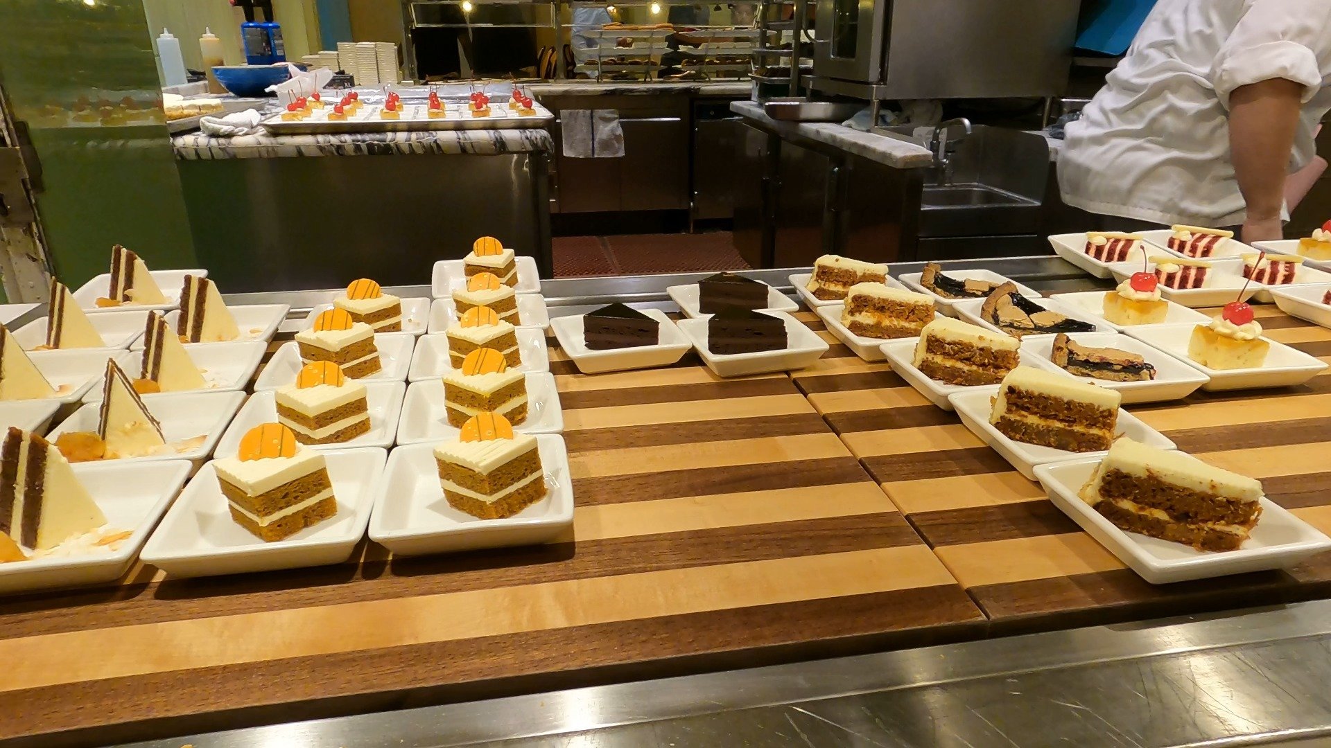 Slices of carrot cake, chocolate cake, and other cake squares at The Buffet at Wynn dessert station