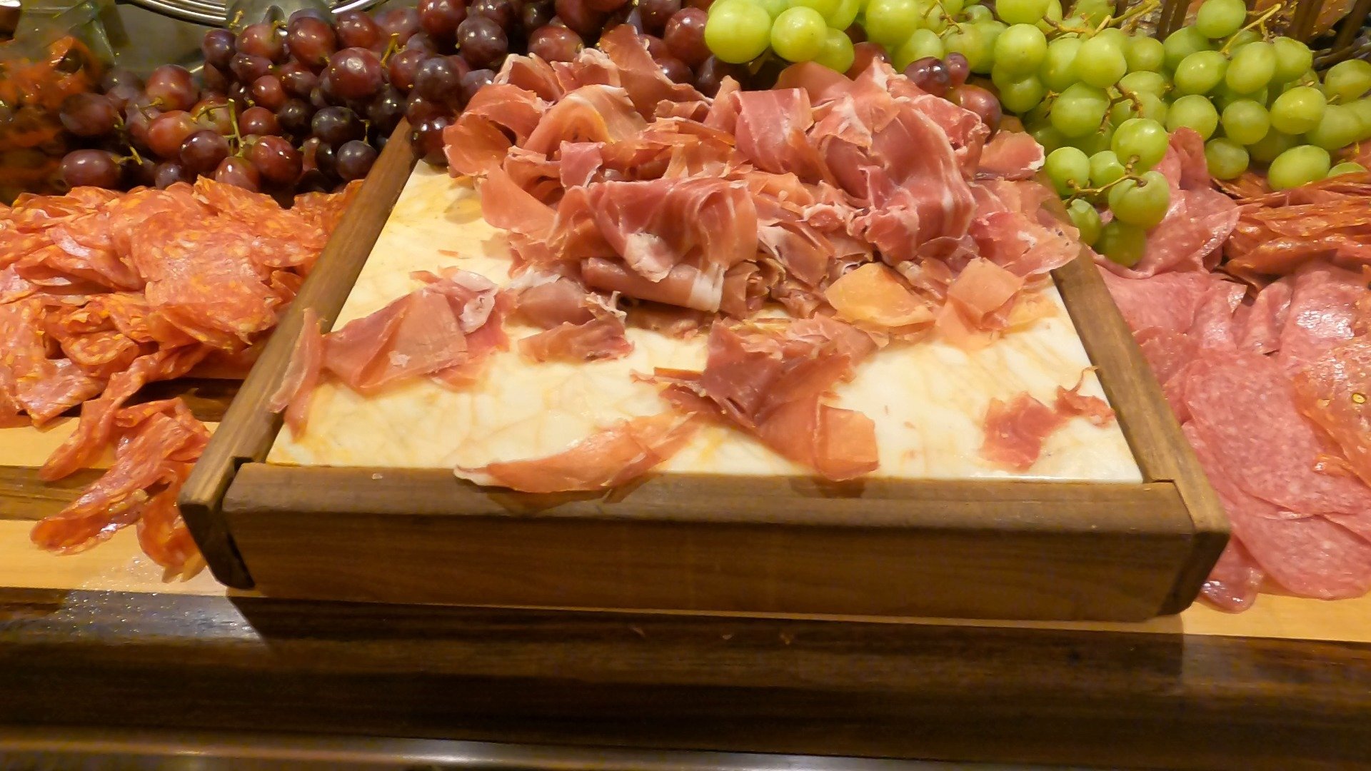 Prosciutto and salami charcuterie board with grapes at The Buffet at Wynn