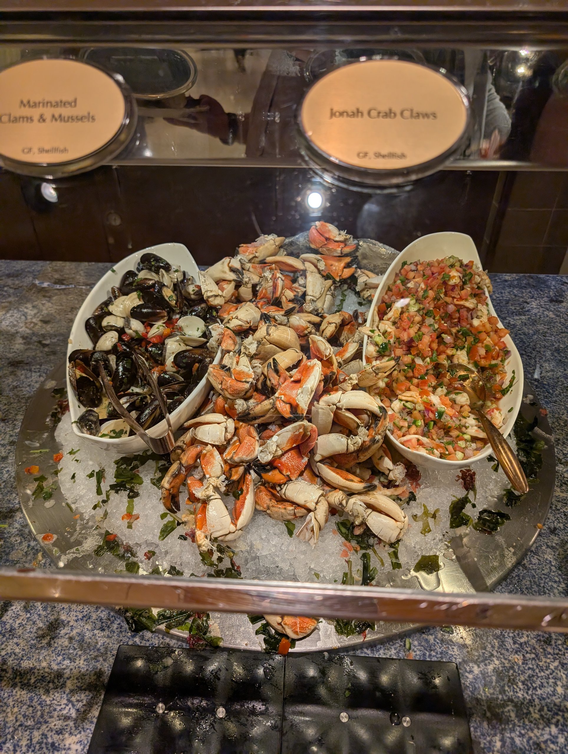 Marinated clams, mussels, and Jonah crab claws on ice at The Buffet at Wynn