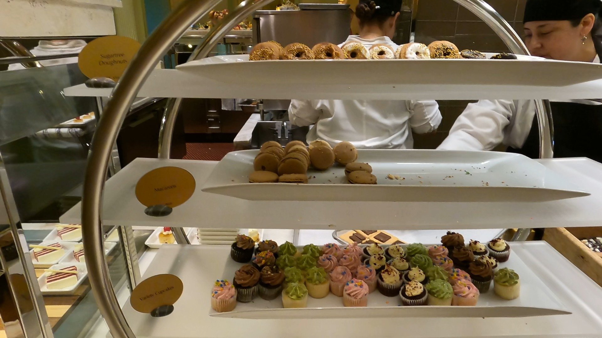 Three tier dessert display with donuts, macarons, and cupcakes at The Buffet at Wynn