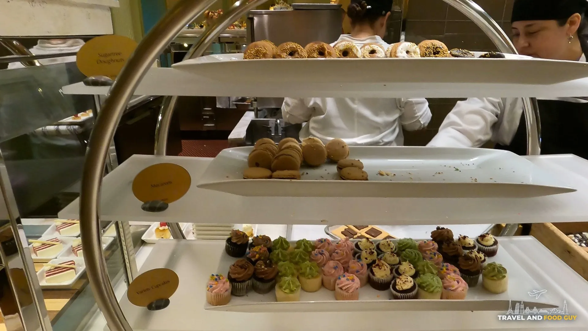 Three tier dessert display with donuts, macarons, and cupcakes at The Buffet at Wynn