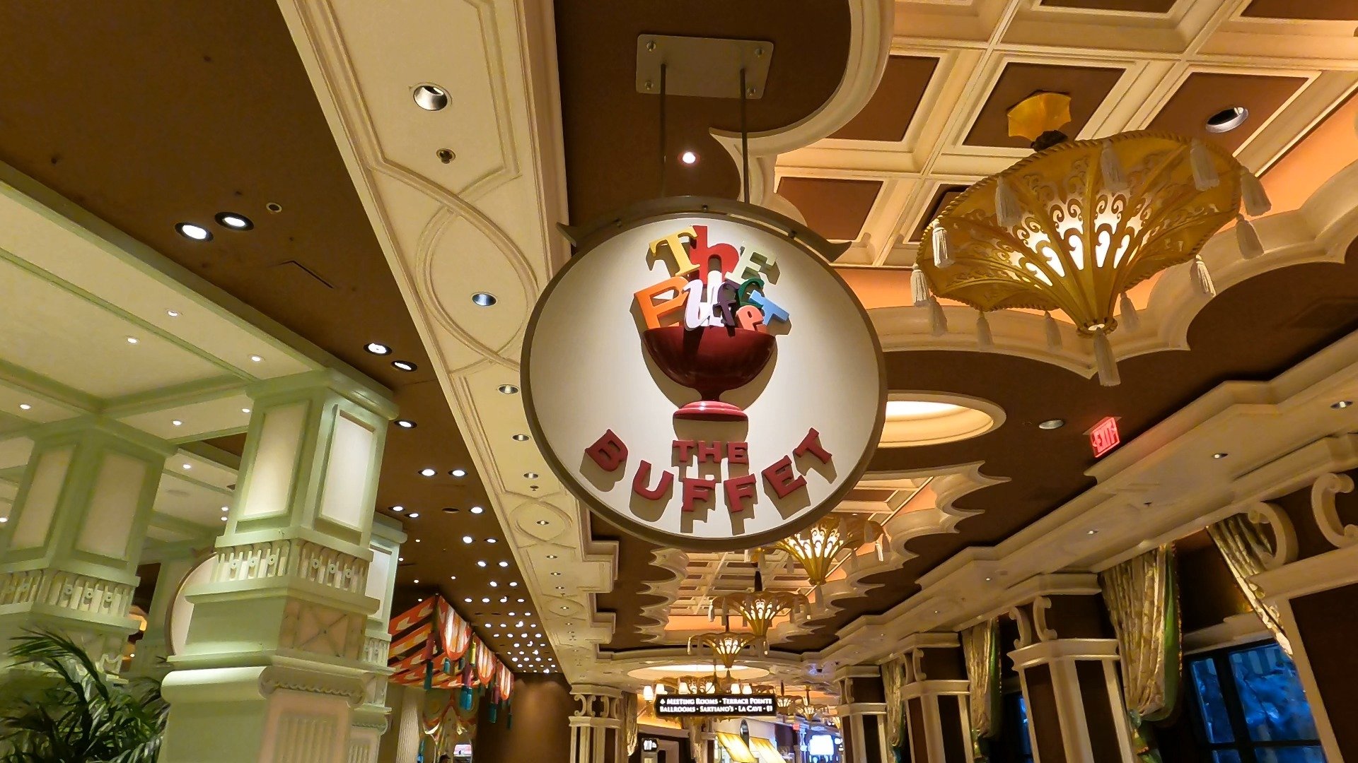 The Buffet at Wynn entrance signage with the iconic ice cream sundae logo hanging over the corridor inside Wynn Las Vegas