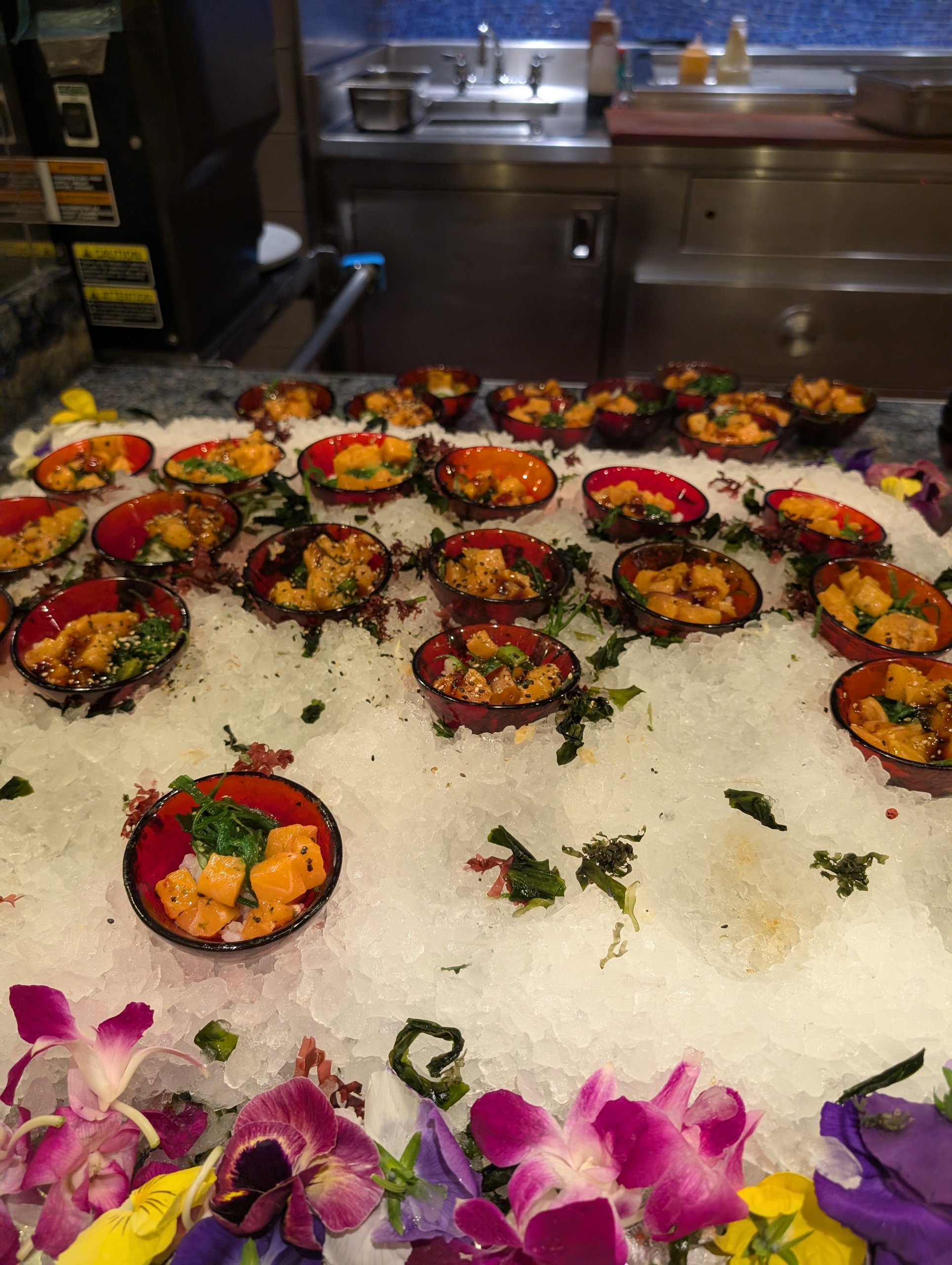 Hawaiian poke station at The Buffet at Wynn with bowls of salmon and tuna poke on ice