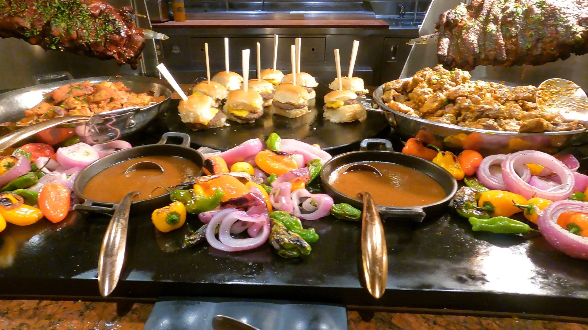 Sliders, chicken wings, and grilled vegetables at the carving station of The Buffet at Wynn