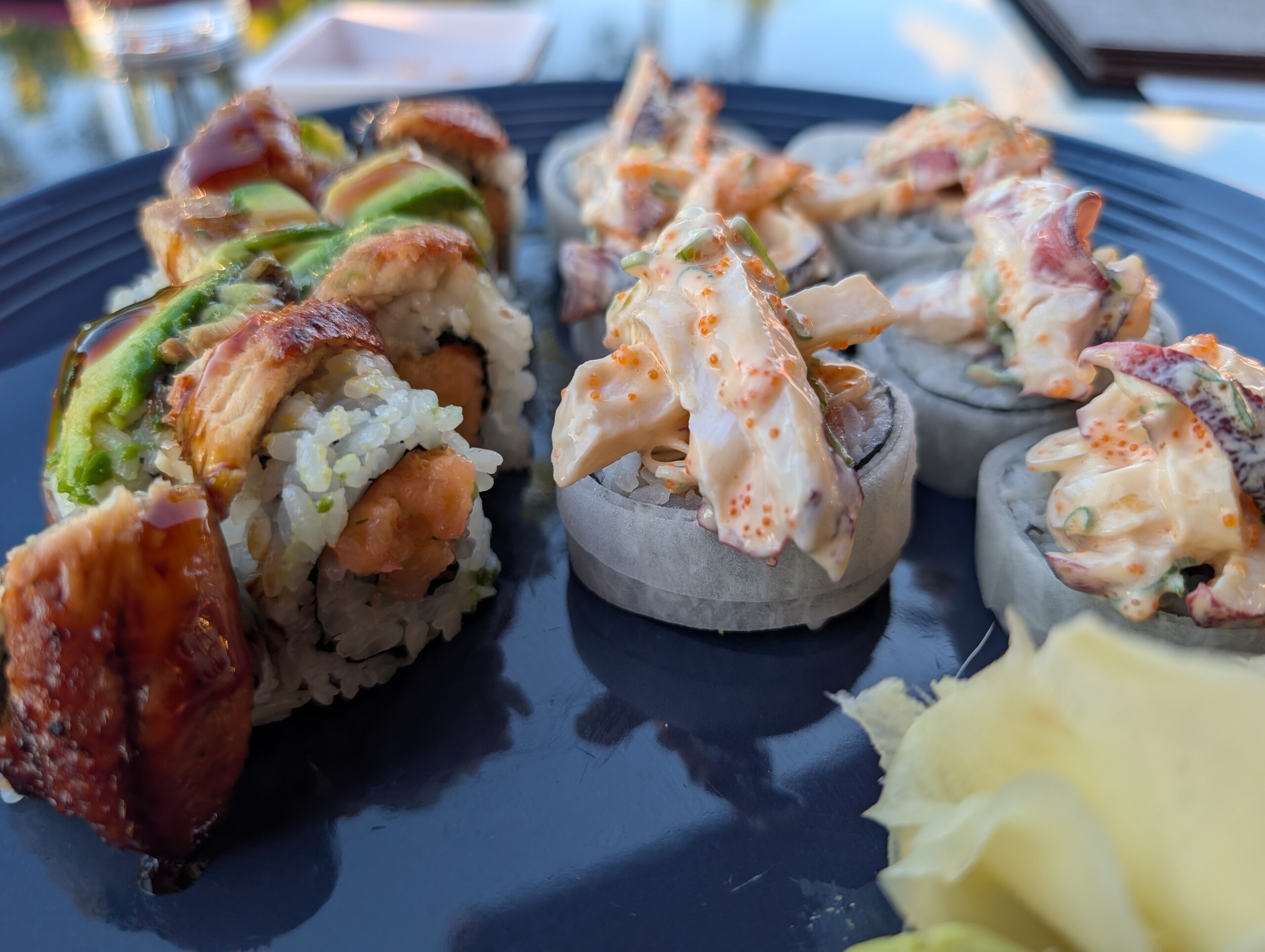 Dragon roll with eel and avocado beside Seafoods Mountain roll at Deba Sushi Bar