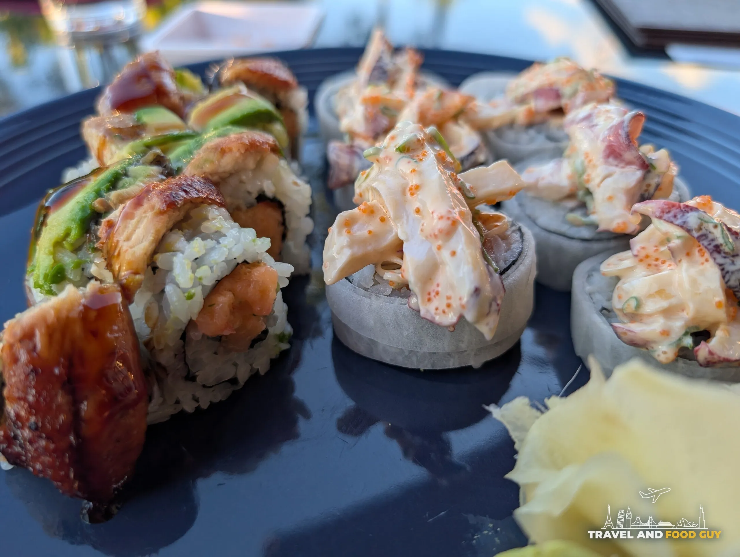 Dragon roll with eel and avocado beside Seafoods Mountain roll at Deba Sushi Bar