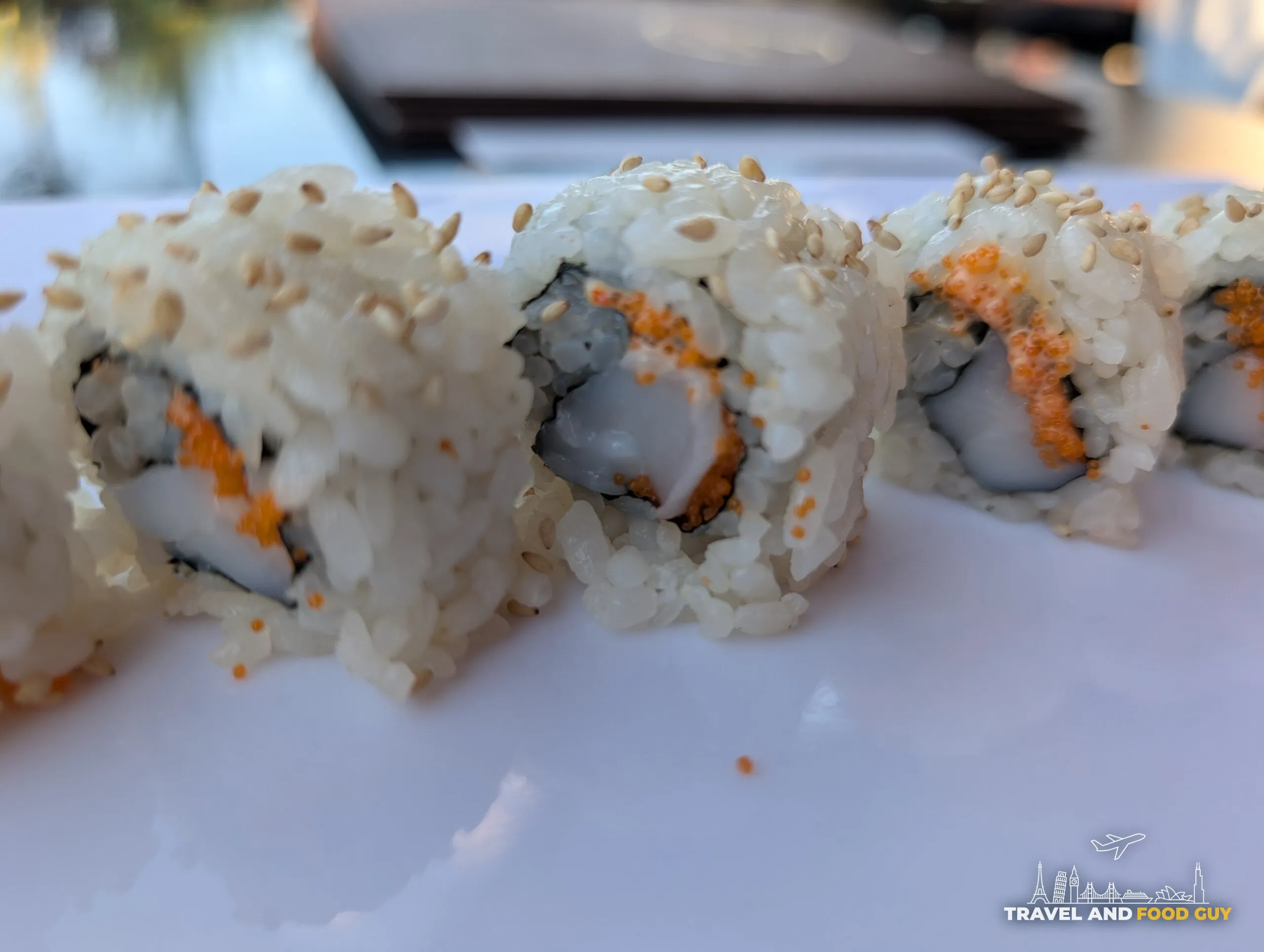 Closeup of the spicy scallop roll at Deba Sushi Bar showing whole scallop pieces