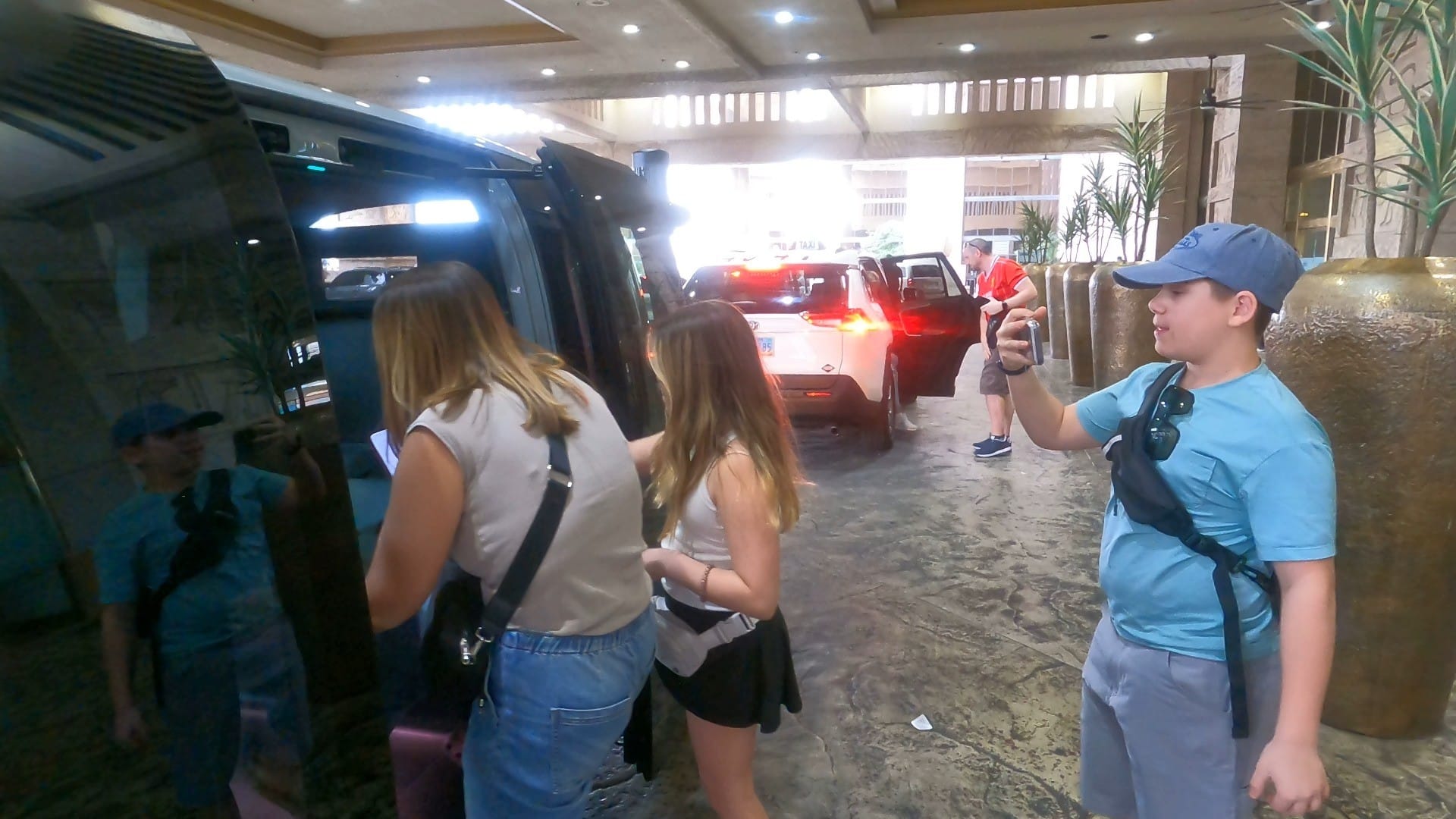 A family climbing into a Zoox driverless robotaxi