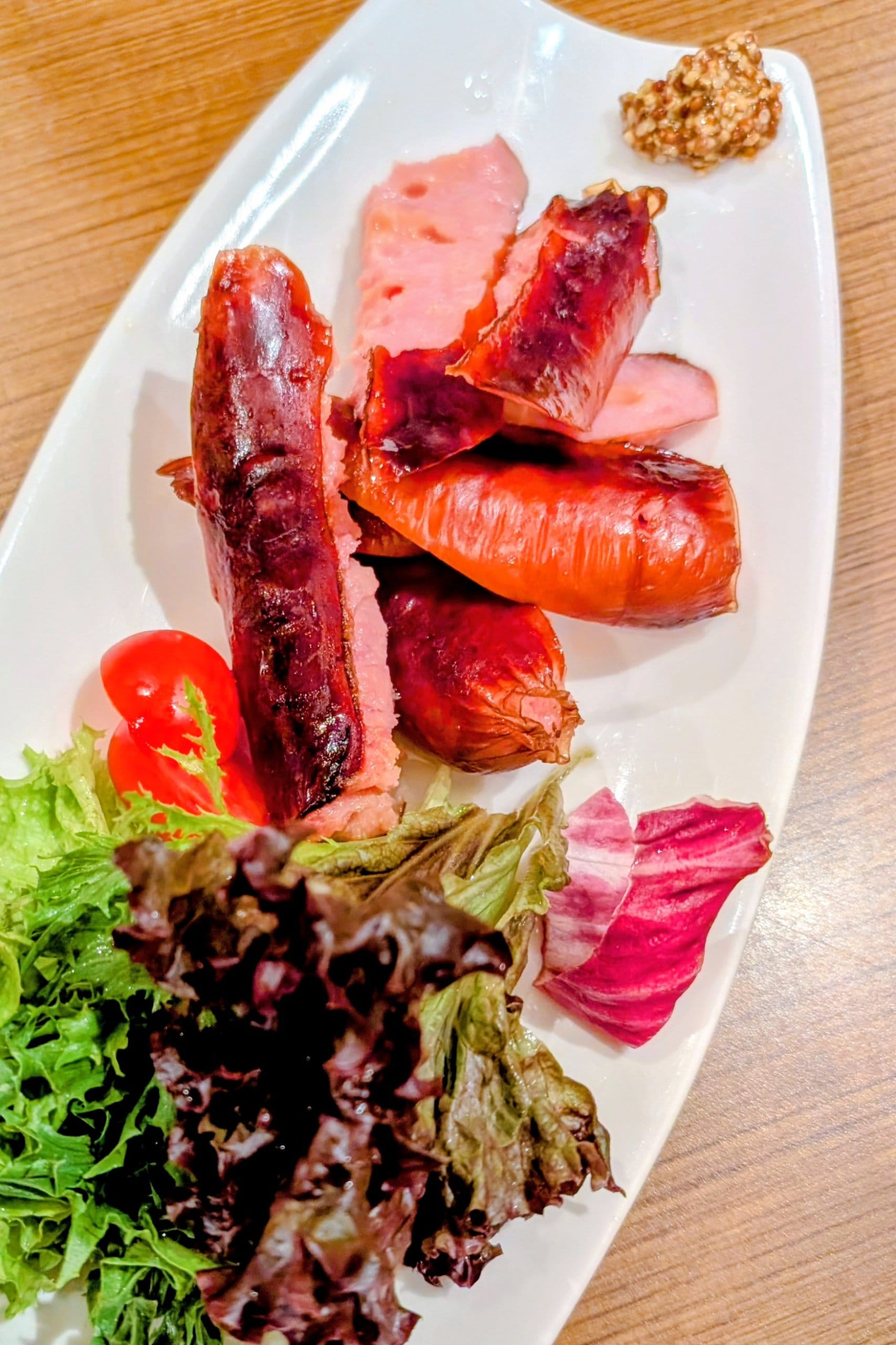 Grilled sausage plate with whole grain mustard and salad at Hanashizuku Singapore