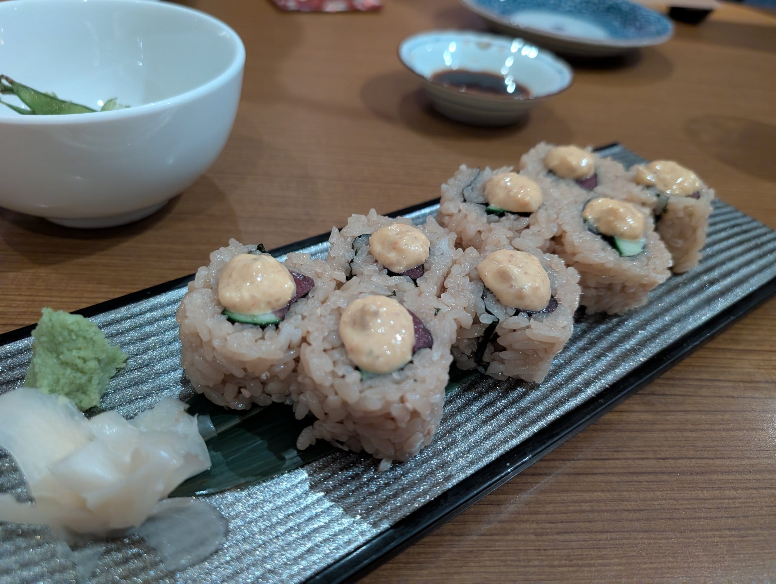 Spicy mayo sushi roll on a striped slate plate at Hanashizuku Singapore